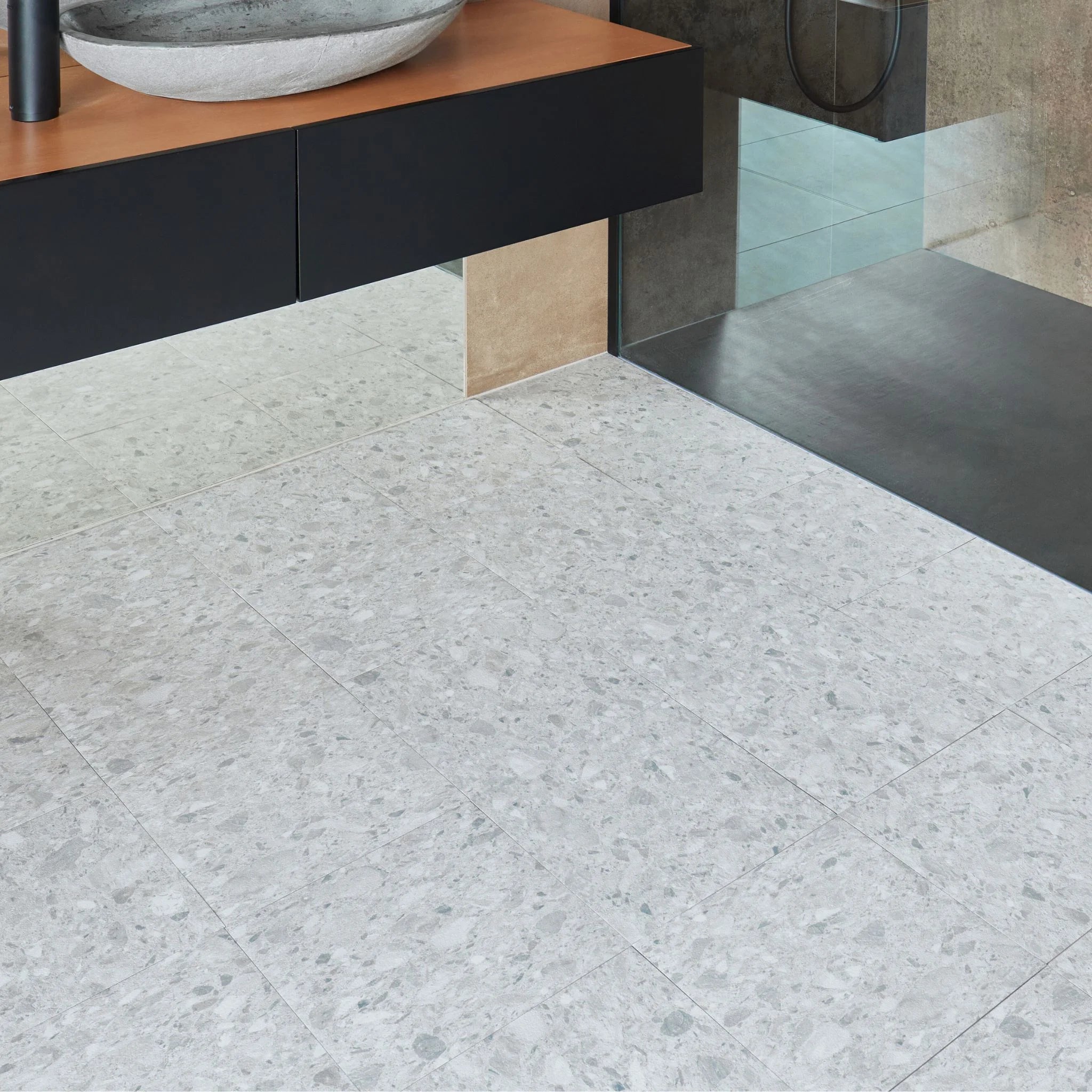 Terrazzo grey vinyl tile flooring in a modern bathroom setting