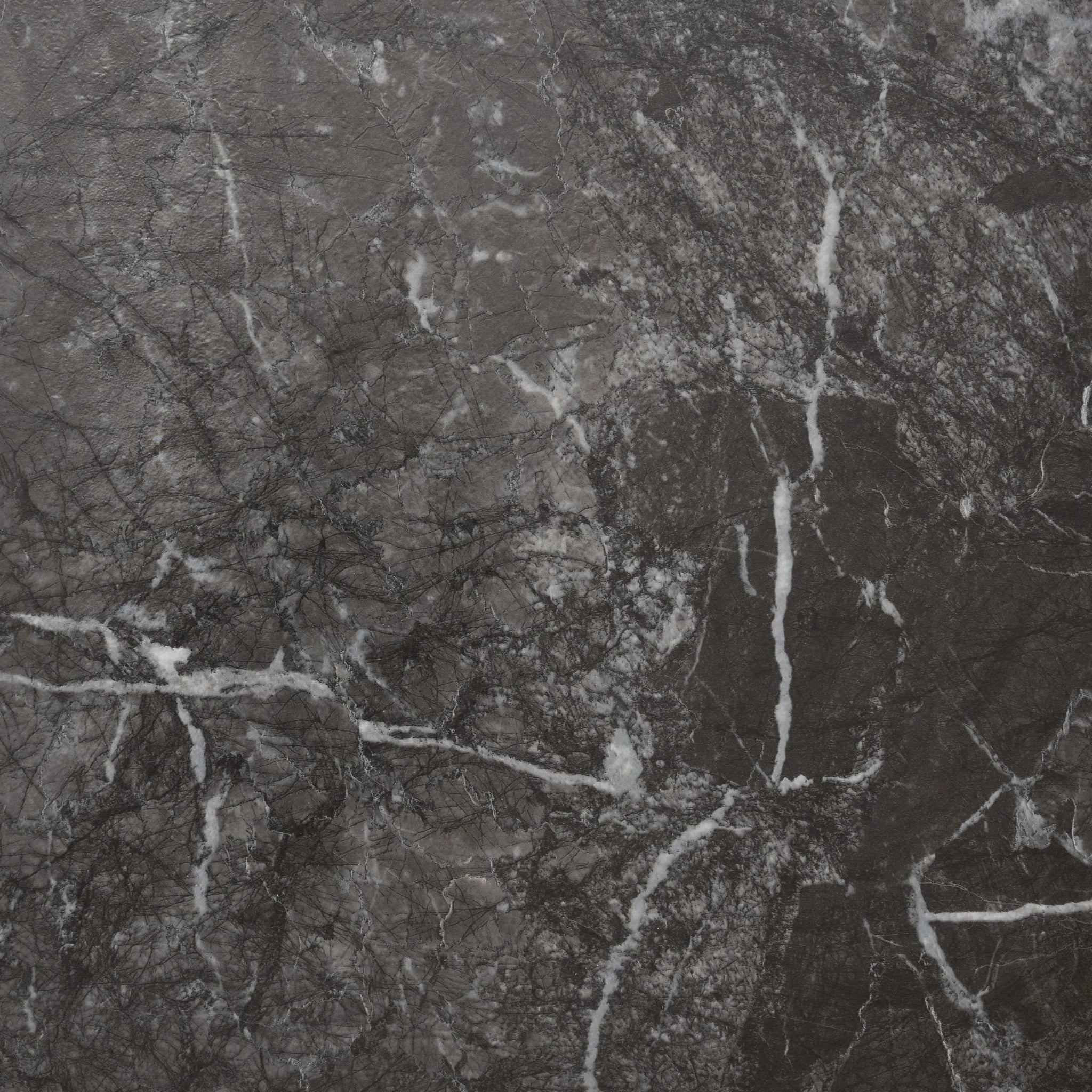 close-up of a concrete-effect vinyl plank in black marble tile