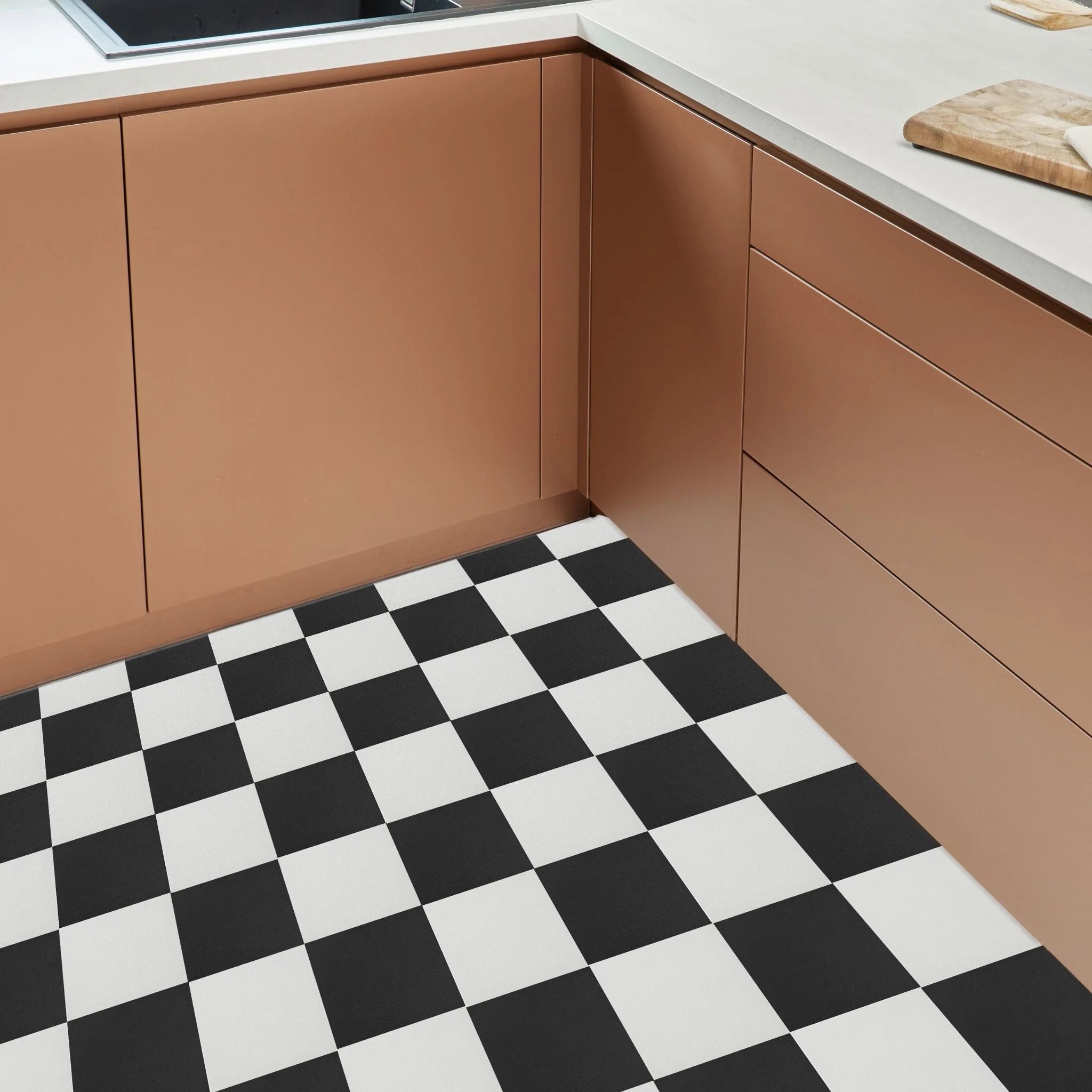 contemporary kitchen featuring brown kitchen furniture with black and white flooring