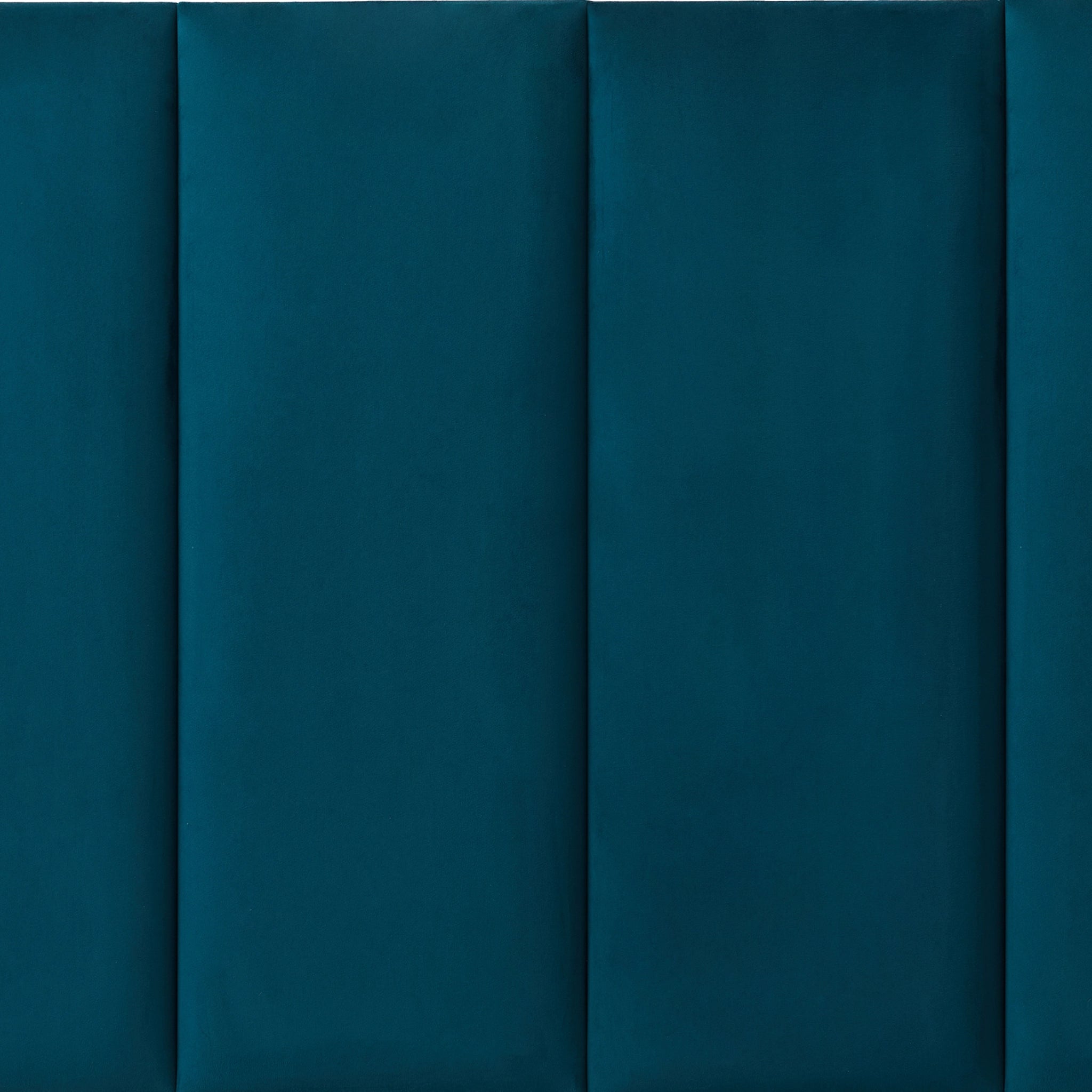 Blue upholstered wall panel with padded surface, close-up view