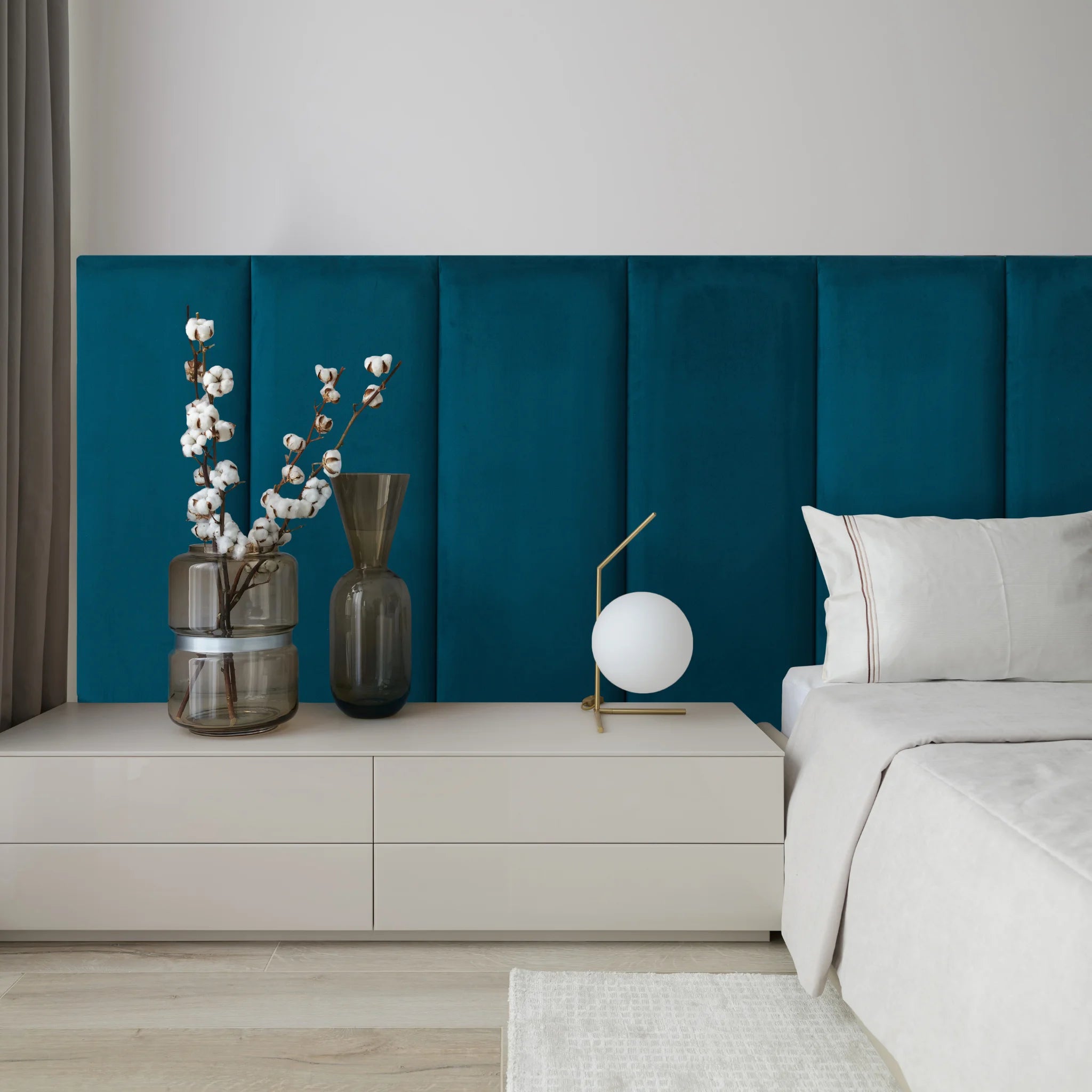 A cozy bedroom featuring blue headboards for beds