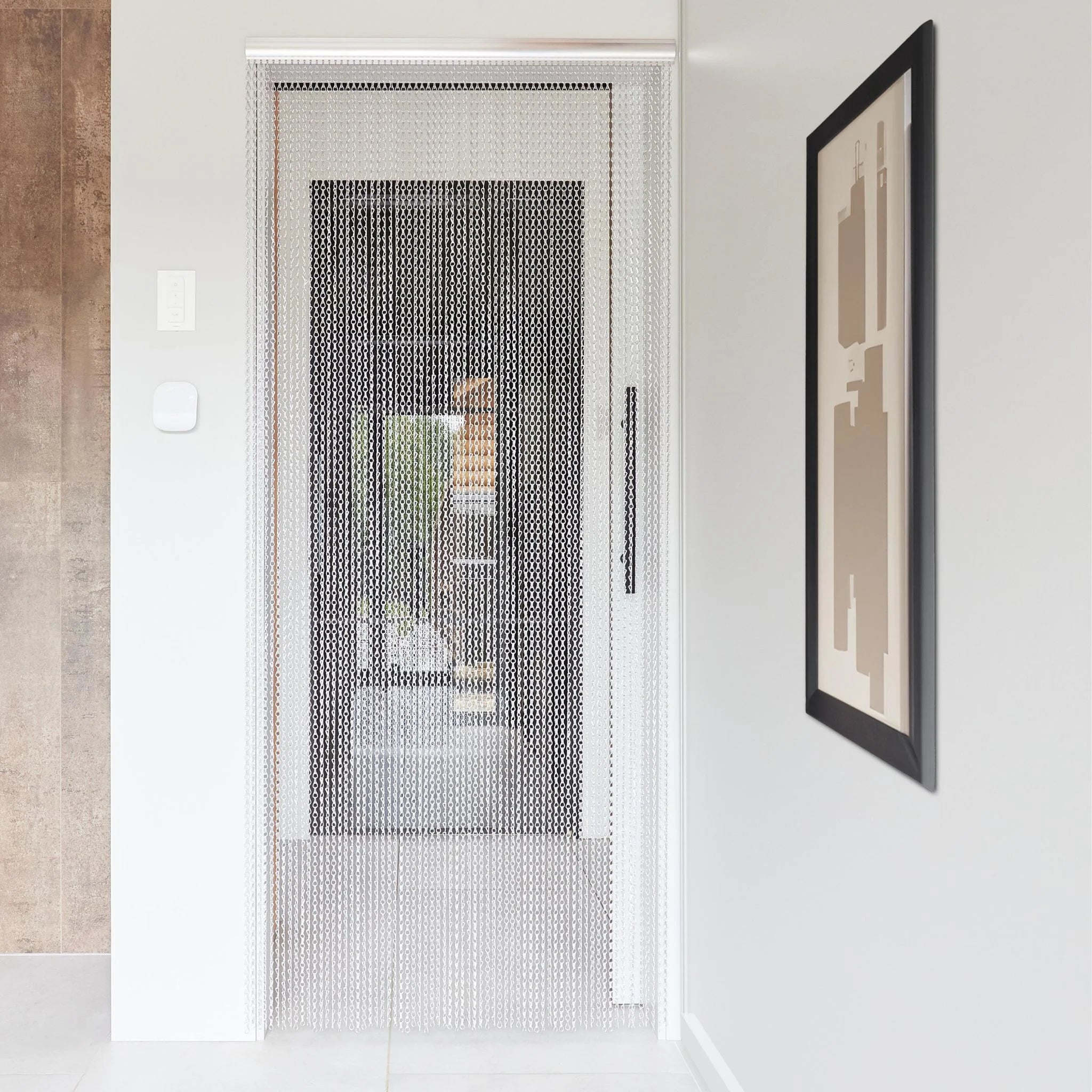 Metal chain curtain hanging in a modern doorway