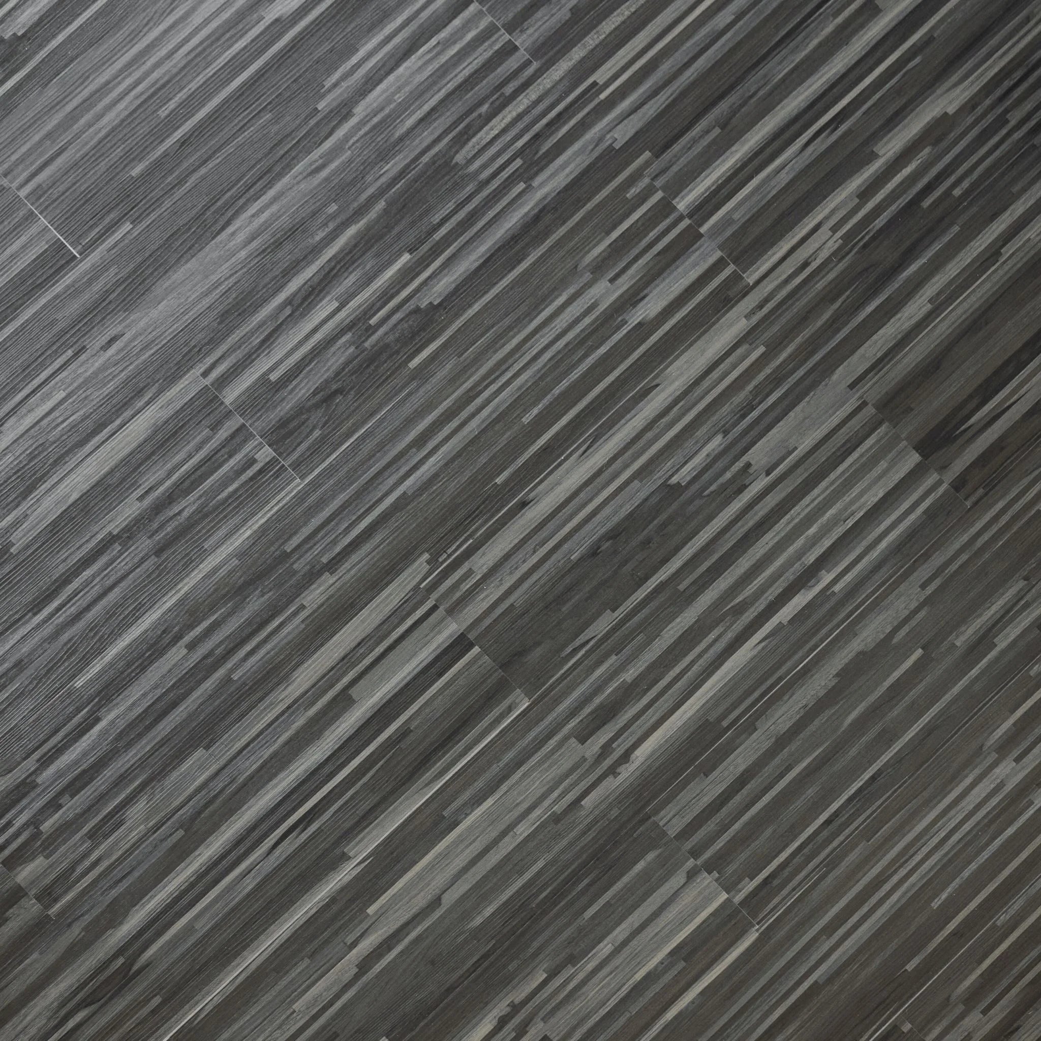 close-up of a wood-effect vinyl plank in stripped dark grey tones