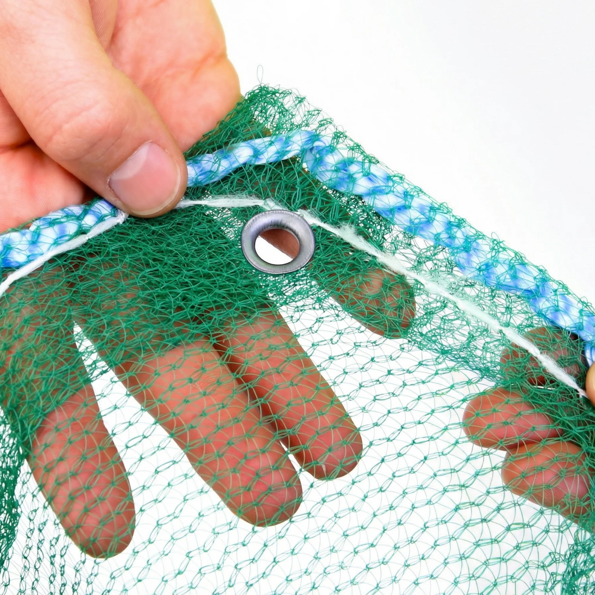 Close-up of scaffold netting with reinforced eyelet