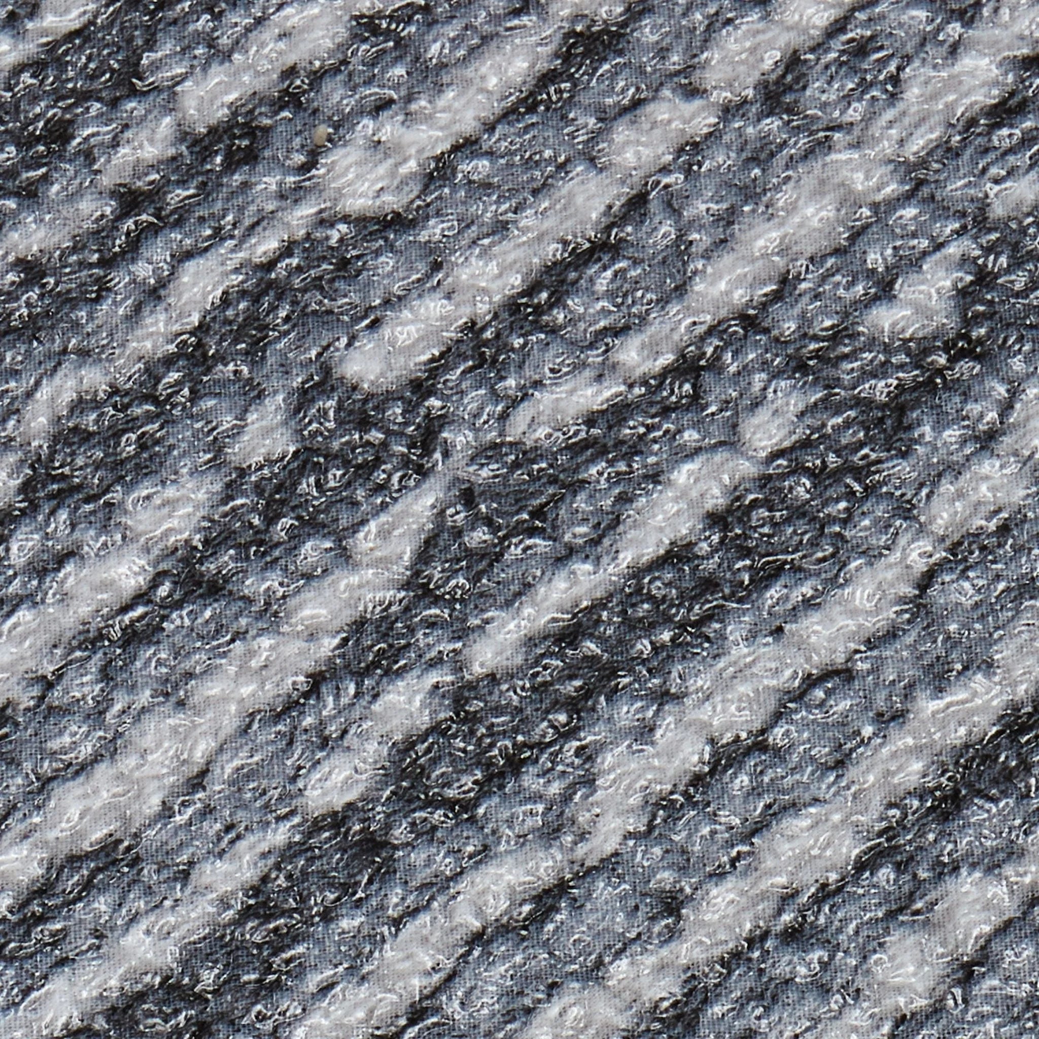 close-up texture of a grey woven carpet, showing detailed fabric weave