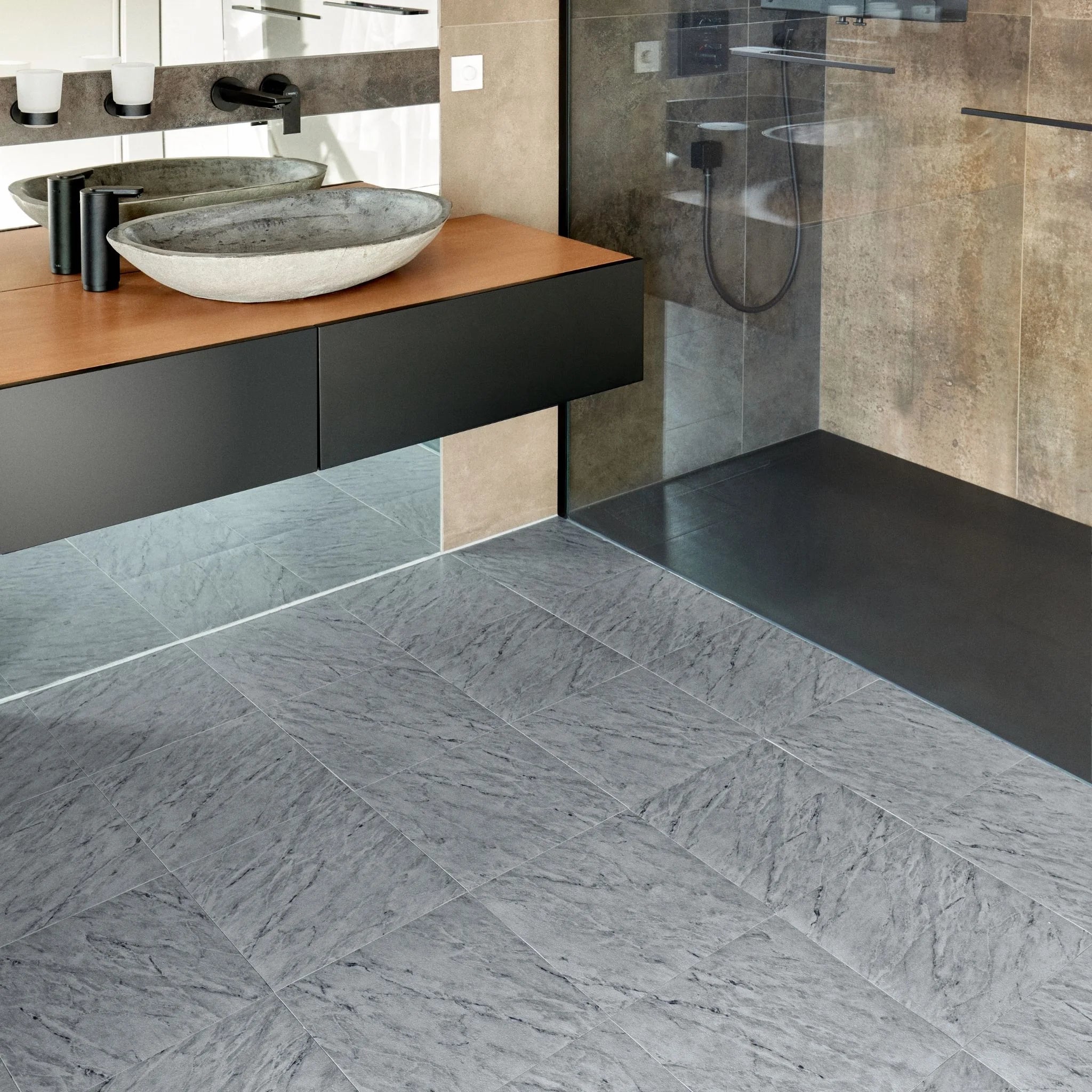 modern bathroom with black vanity, textured grey floor, and minimal accessories