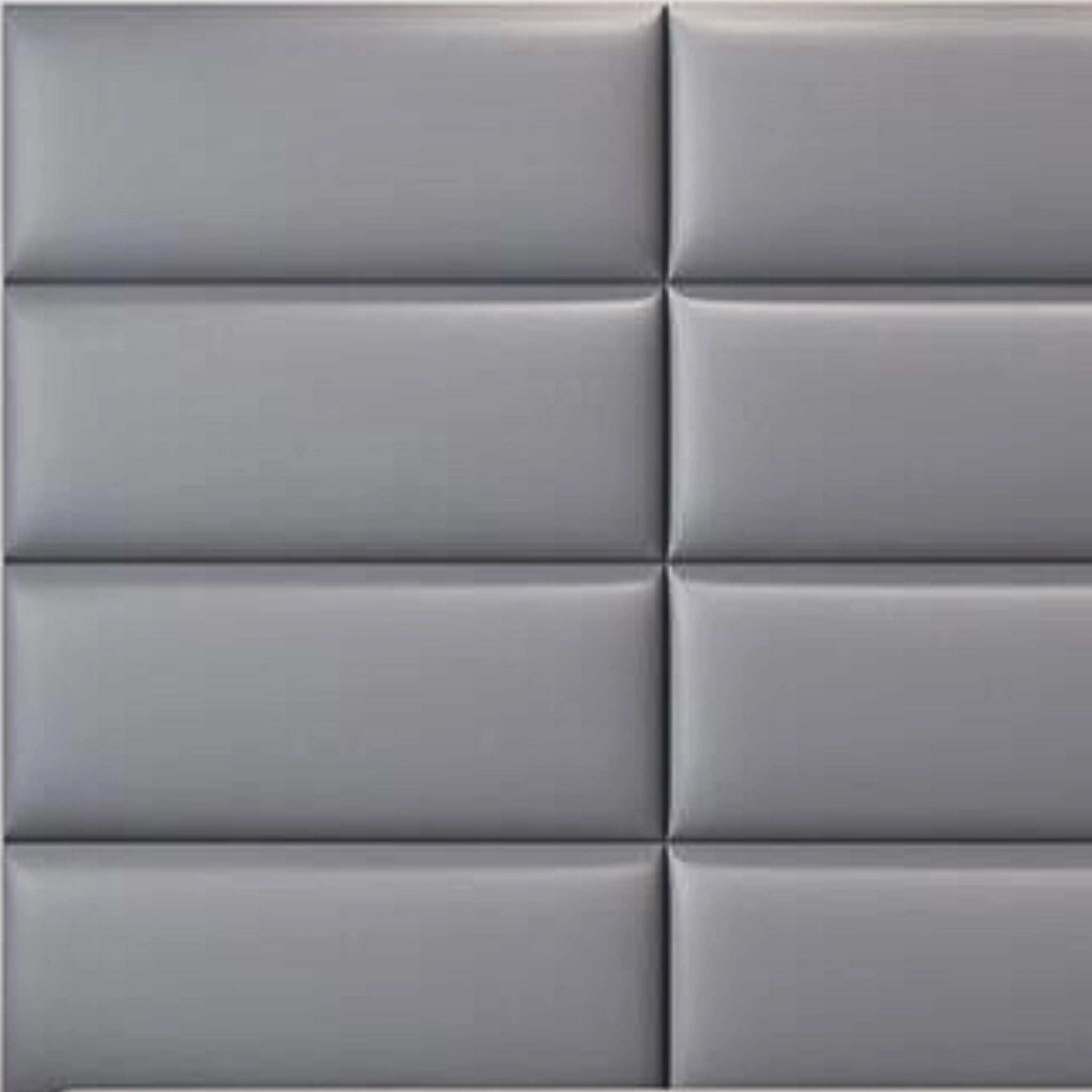 Grey upholstered wall panel with padded surface, close-up view