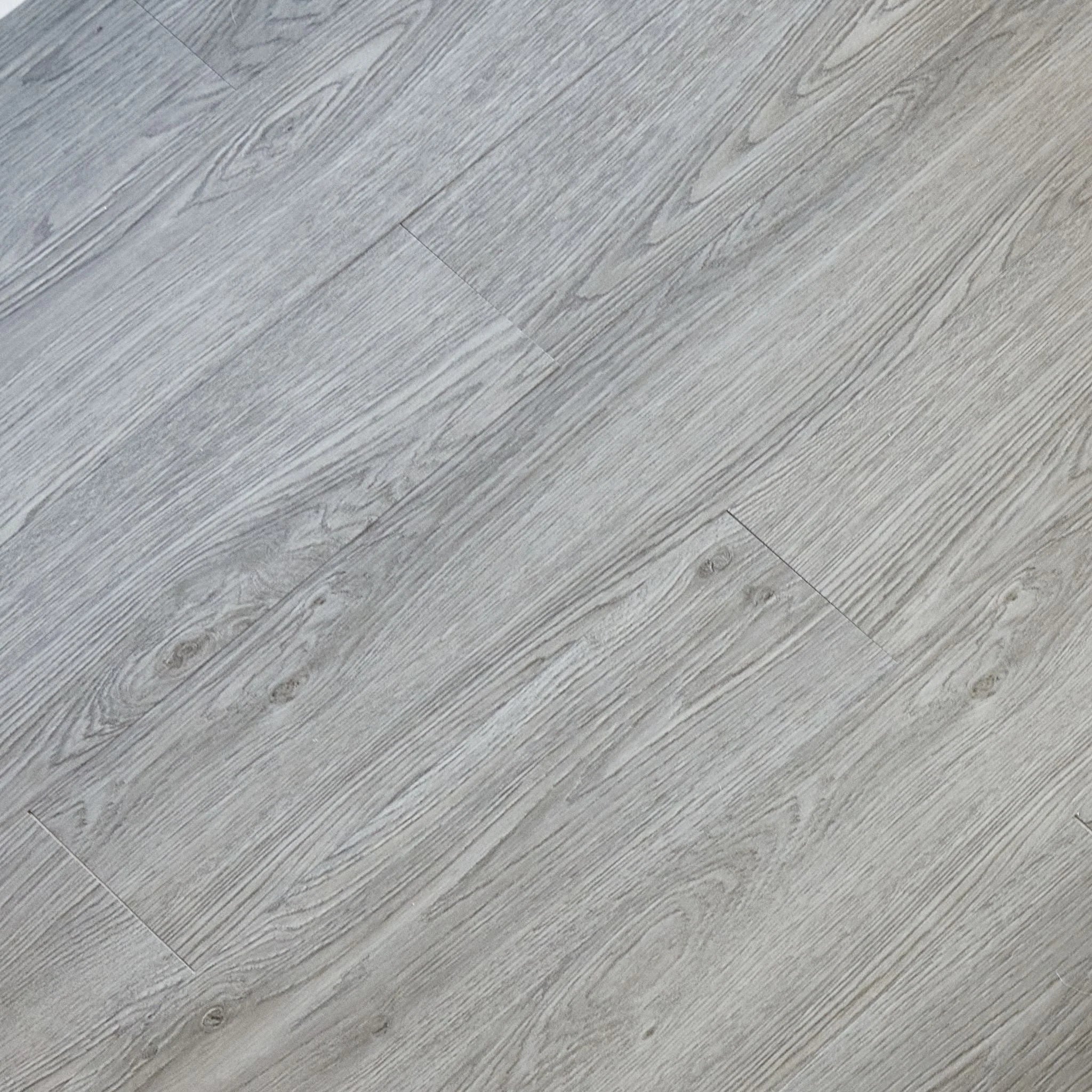 close-up of a wood-effect vinyl plank in dark grey
