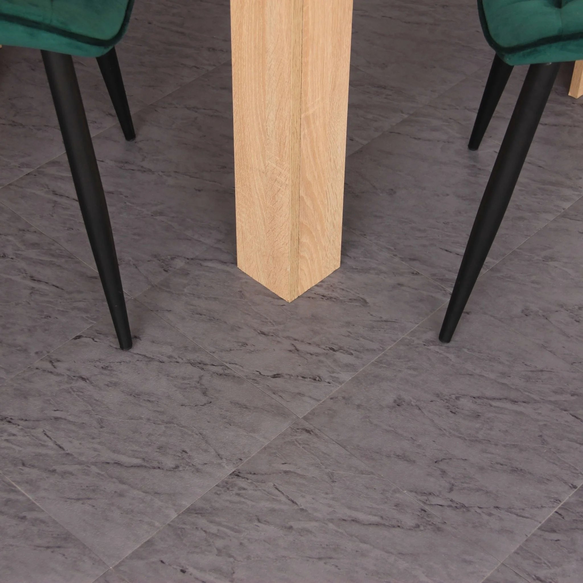 grey marble tile effect flooring under a table and black metal chairs