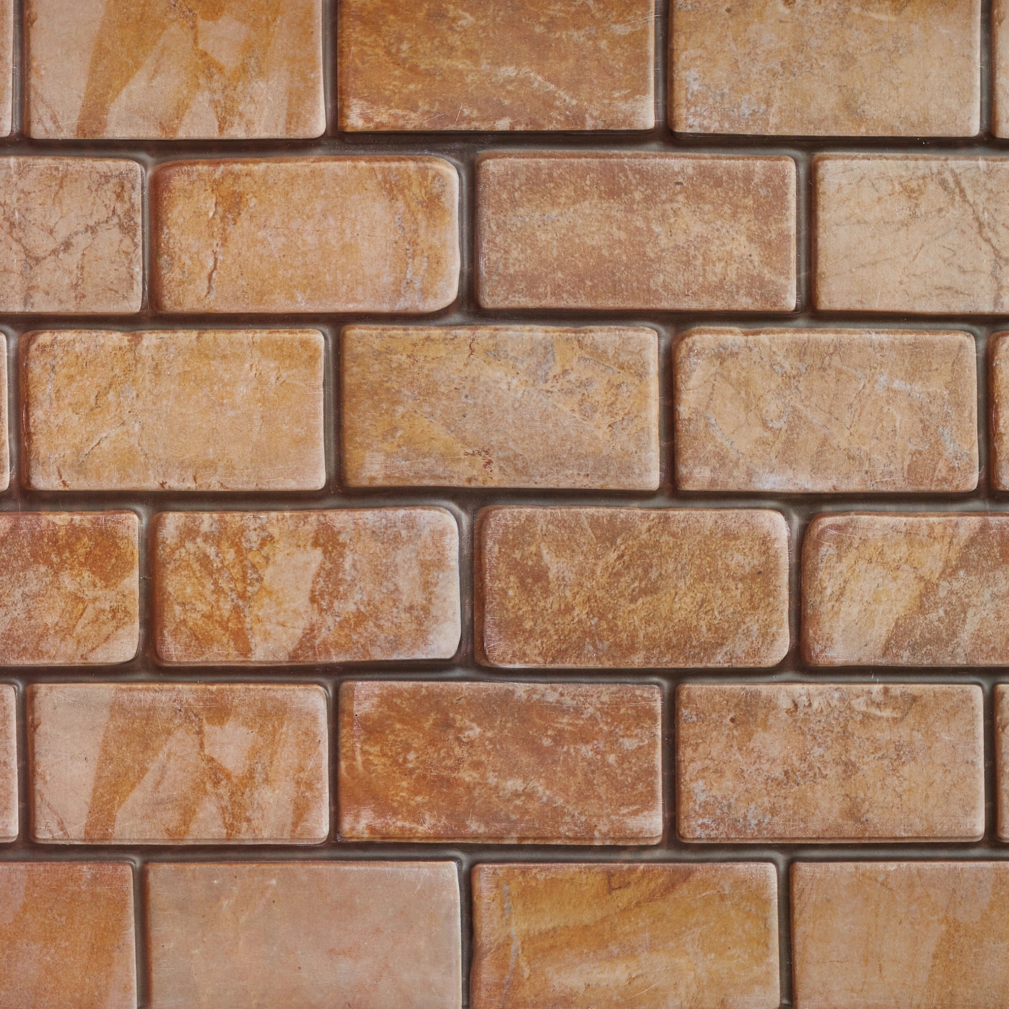 Light brown wall panel with geometric patterns, close-up view