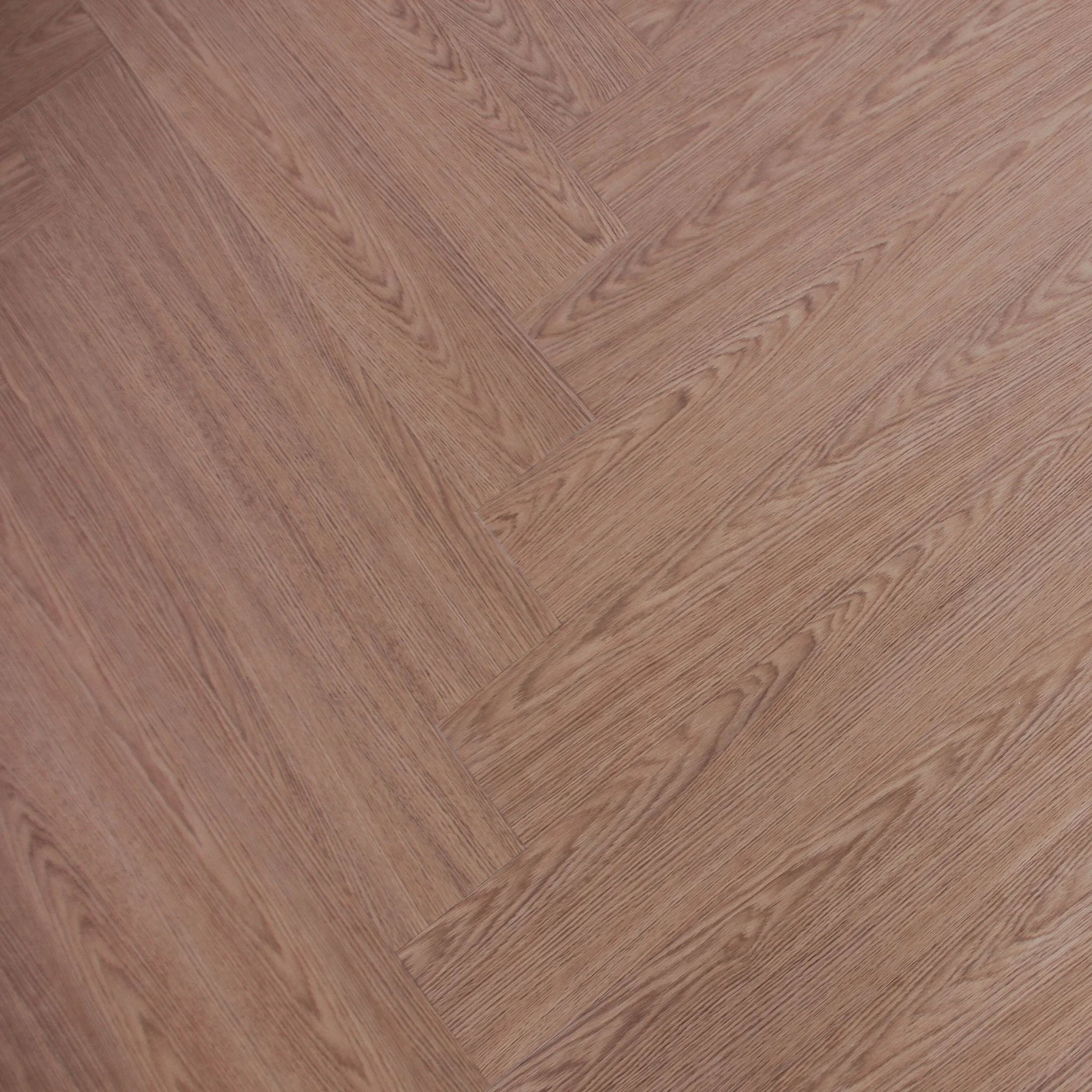 herringbone patterned wood effect vinyl flooring in a rich brown tone