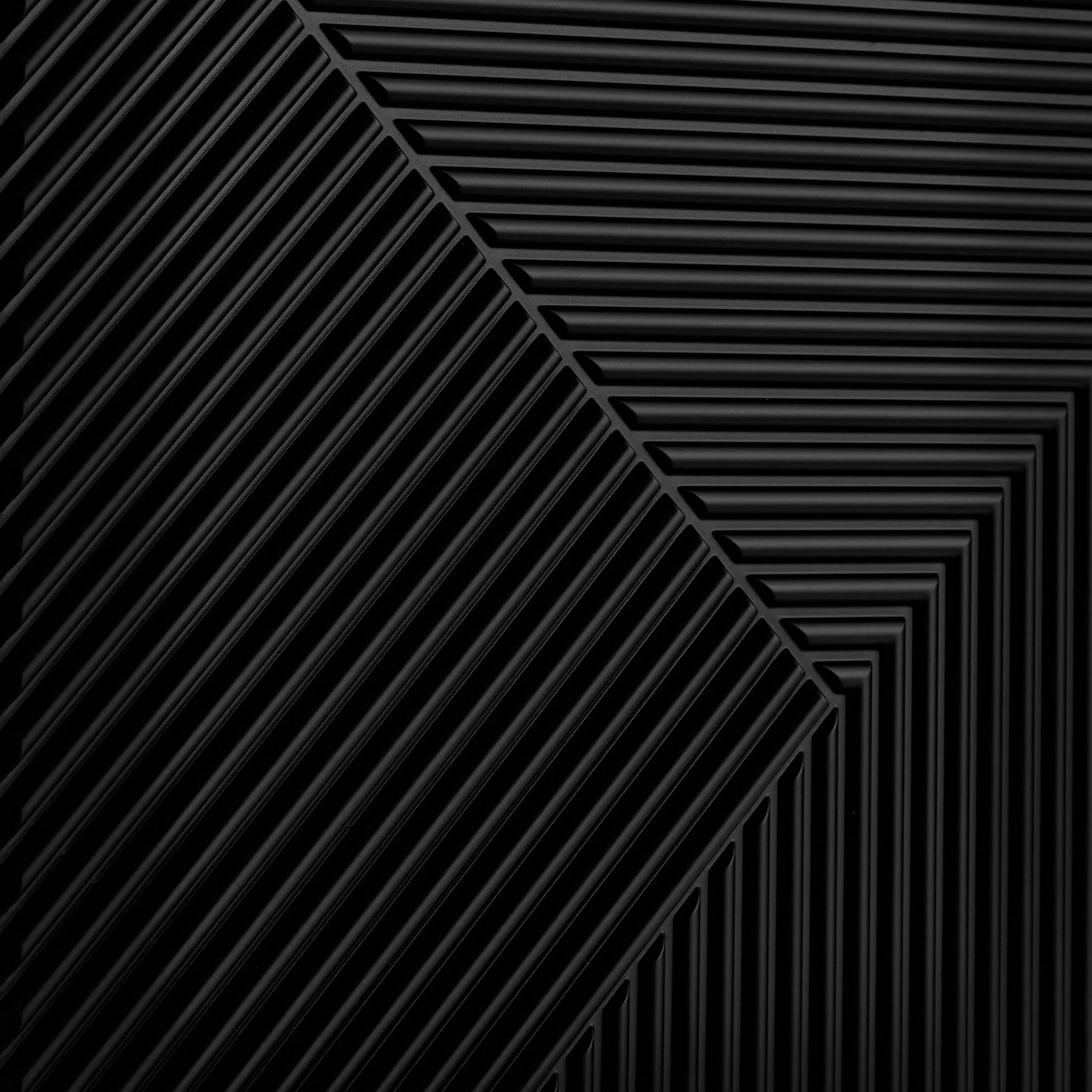 Close-up of black PVC wall panel with geometric design