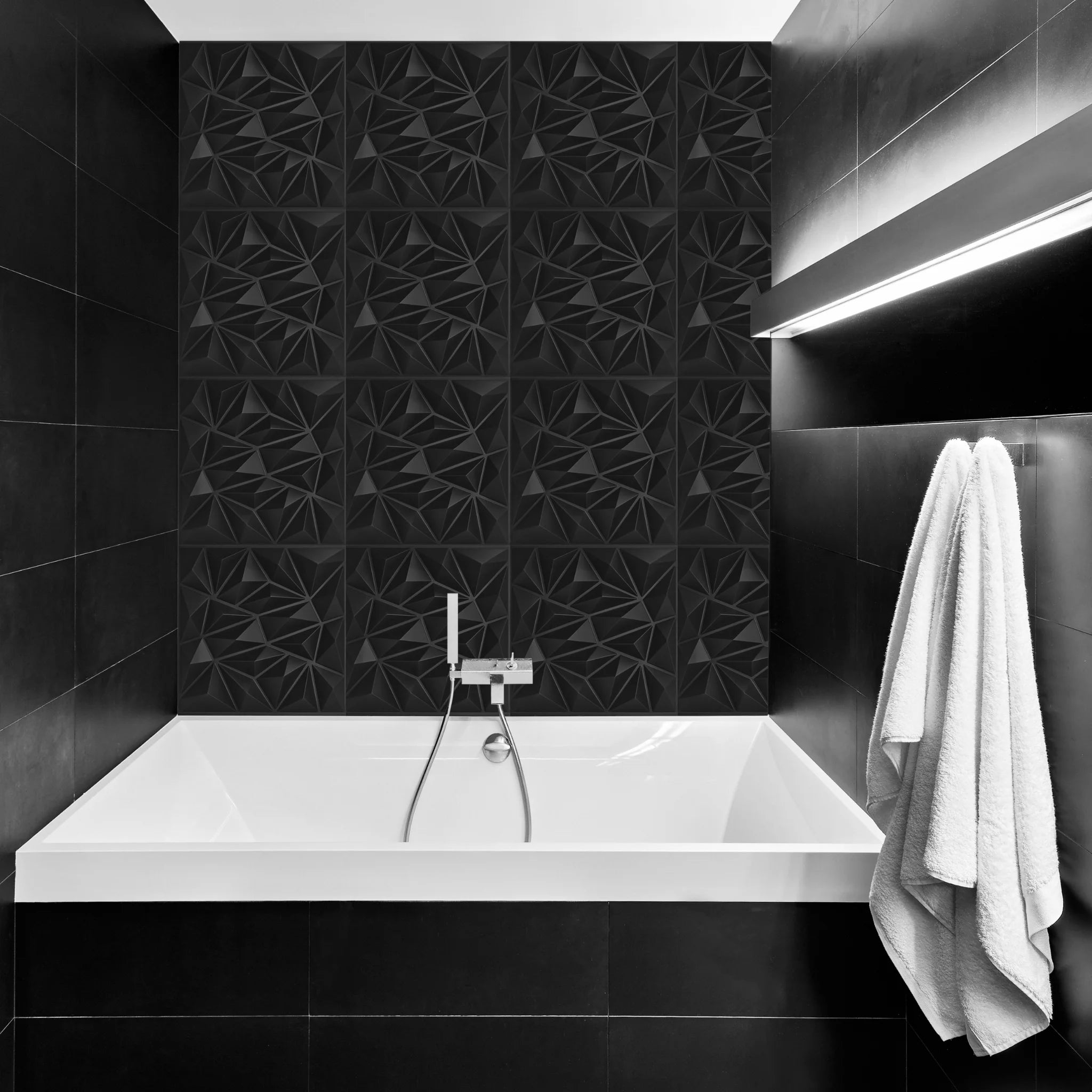 Bathroom with black geometric-patterned PVC wall panels and modern furniture