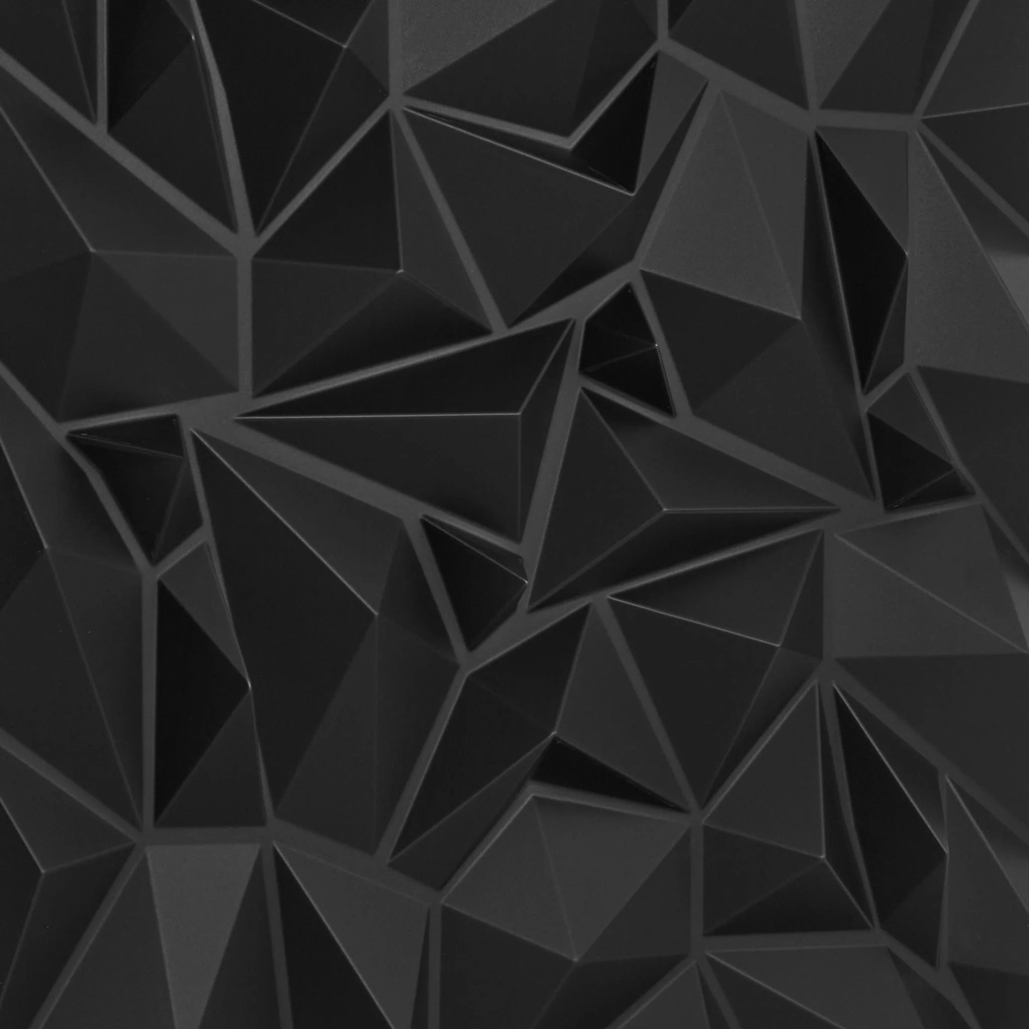Close-up of black PVC wall panel with geometric designs