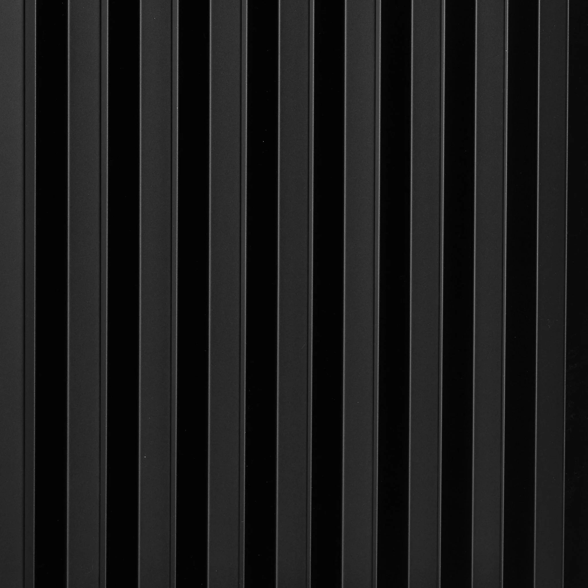 Close-up of black PVC wall panel with vertical ribbed pattern