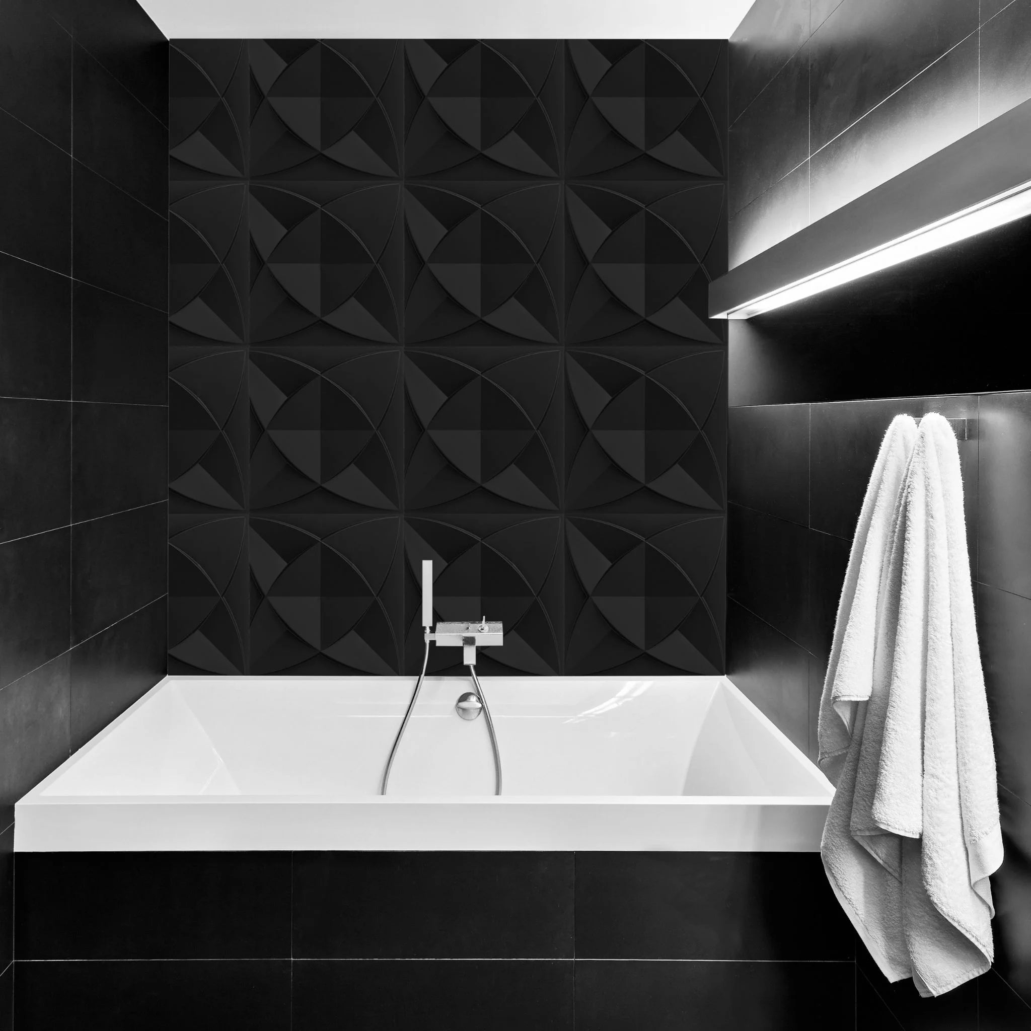 Bathroom with black geometric-patterned PVC wall panels and modern furniture