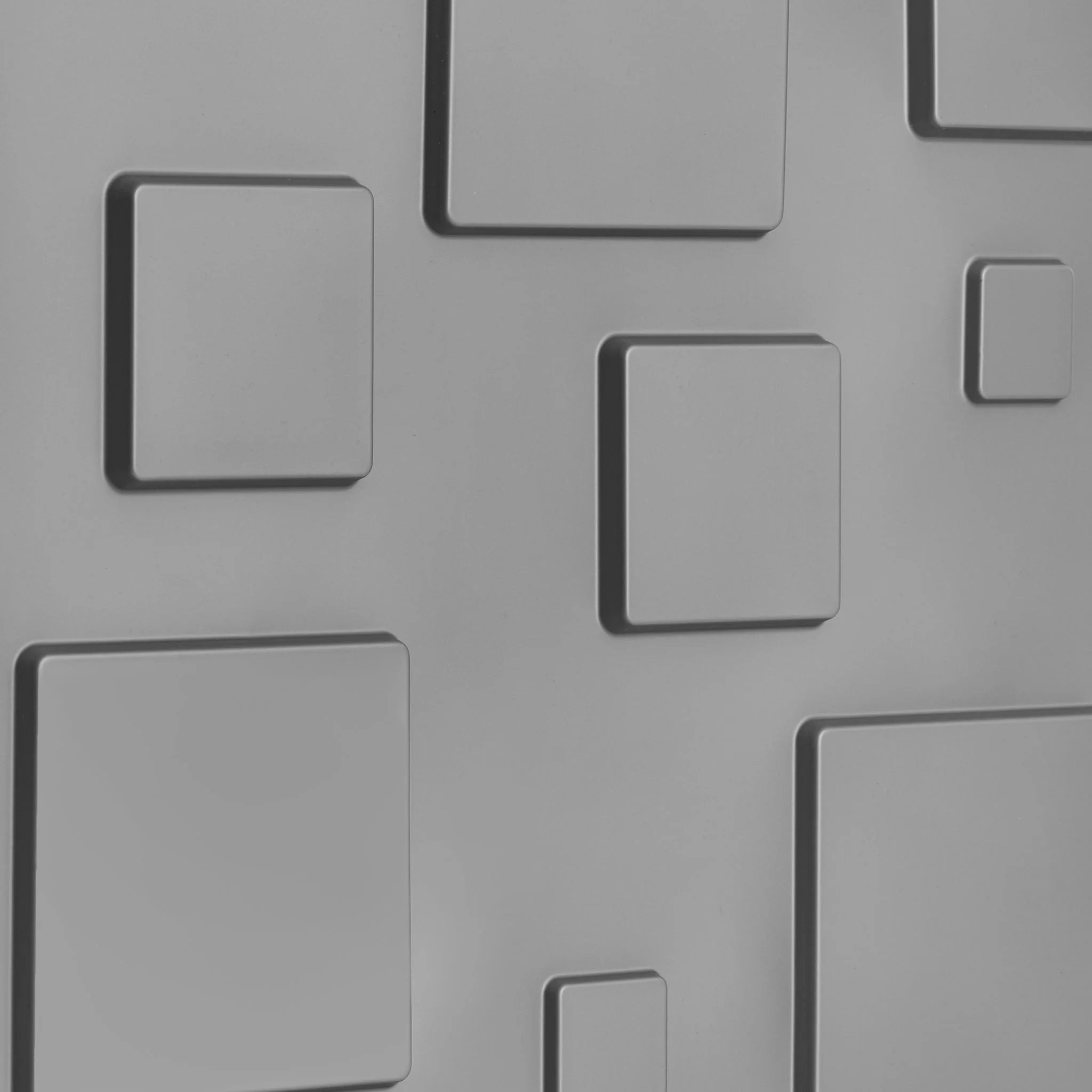 Close-up of silver PVC wall panel with raised square designs