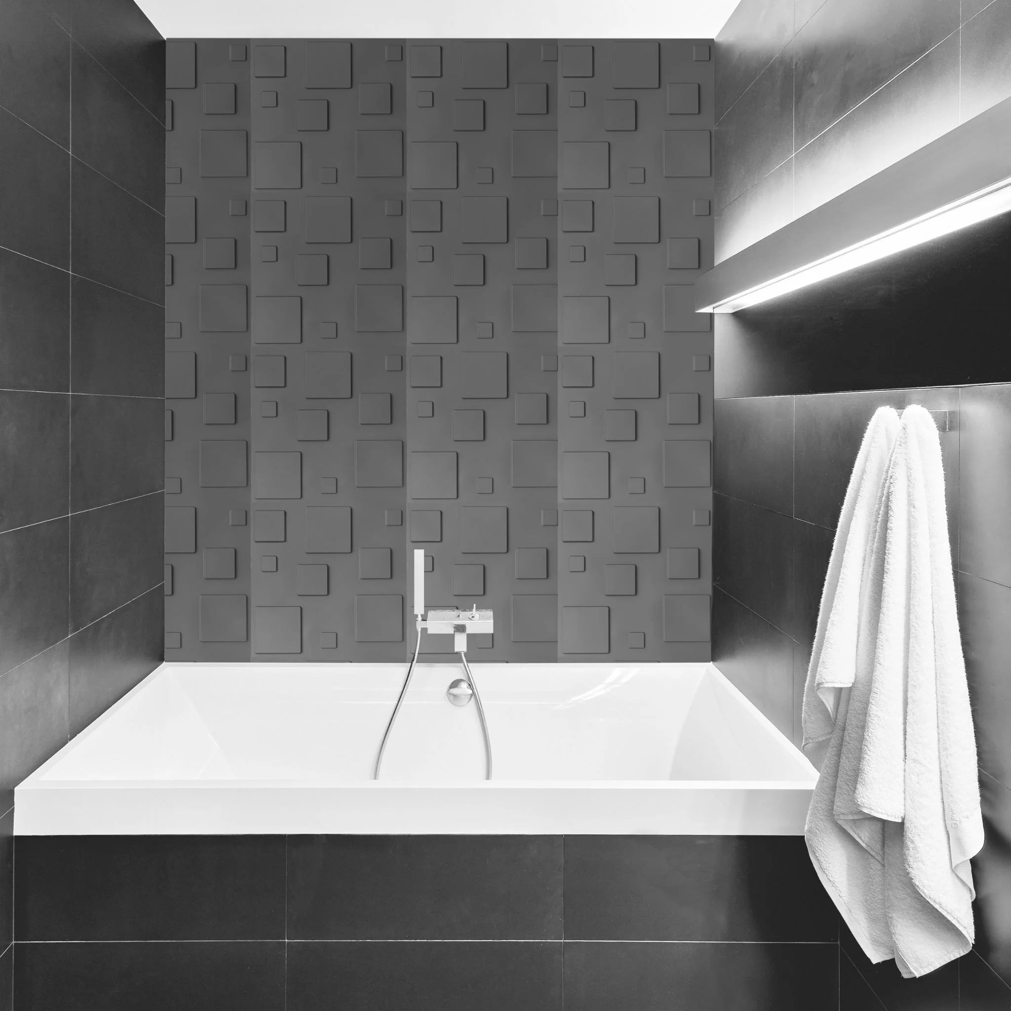 Bathroom with silver square-patterned PVC wall panels and modern furniture