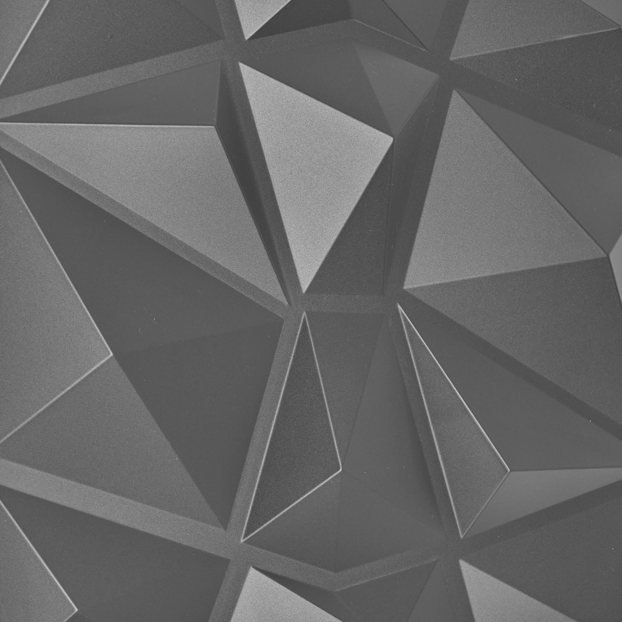 Close-up of silver PVC wall panel with geometric design 