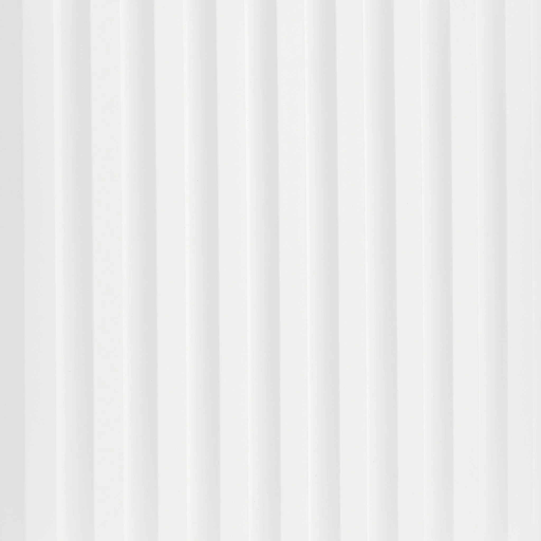 Close-up of white PVC wall panel with vertical ribbed pattern