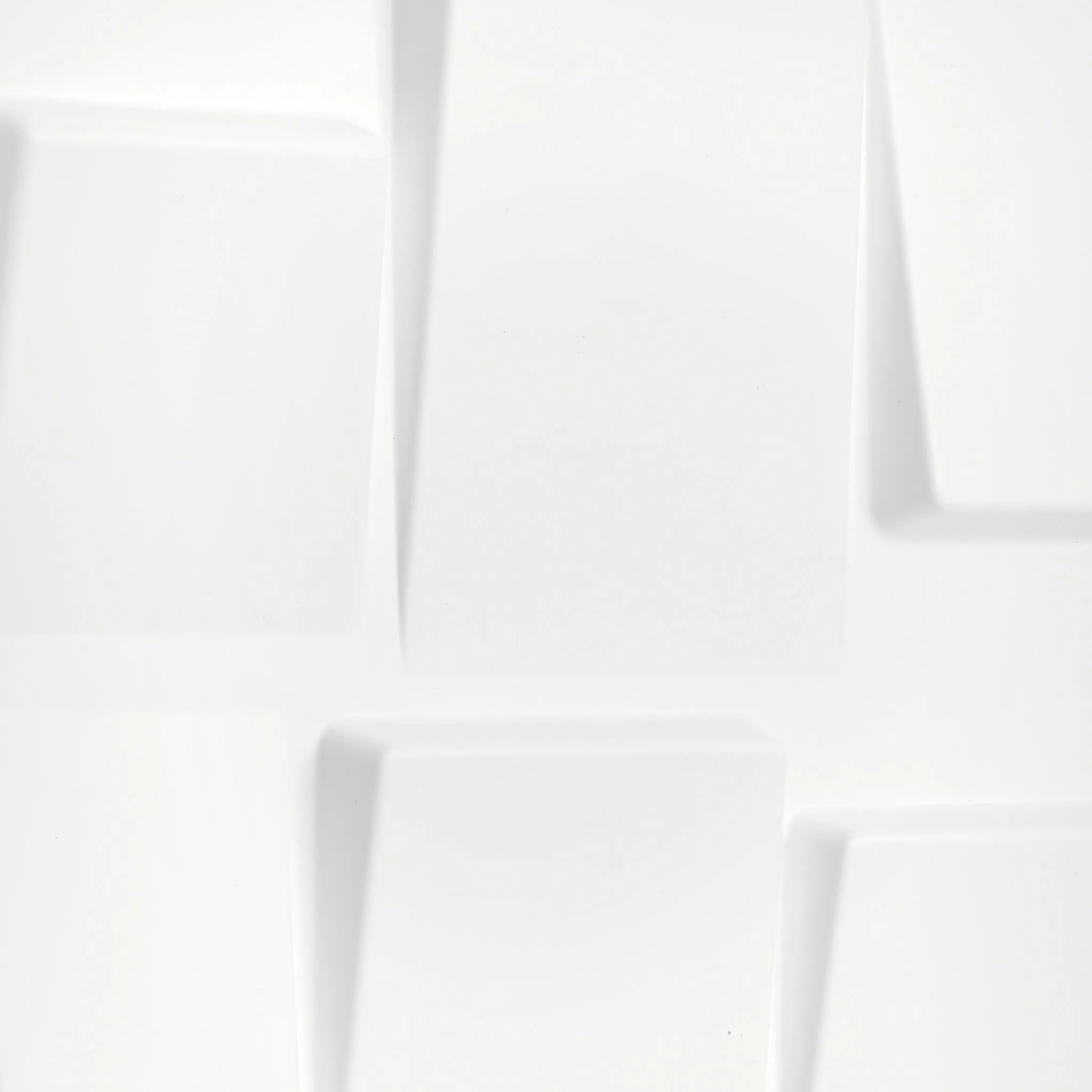 Close-up of white PVC wall panel with geometric shapes