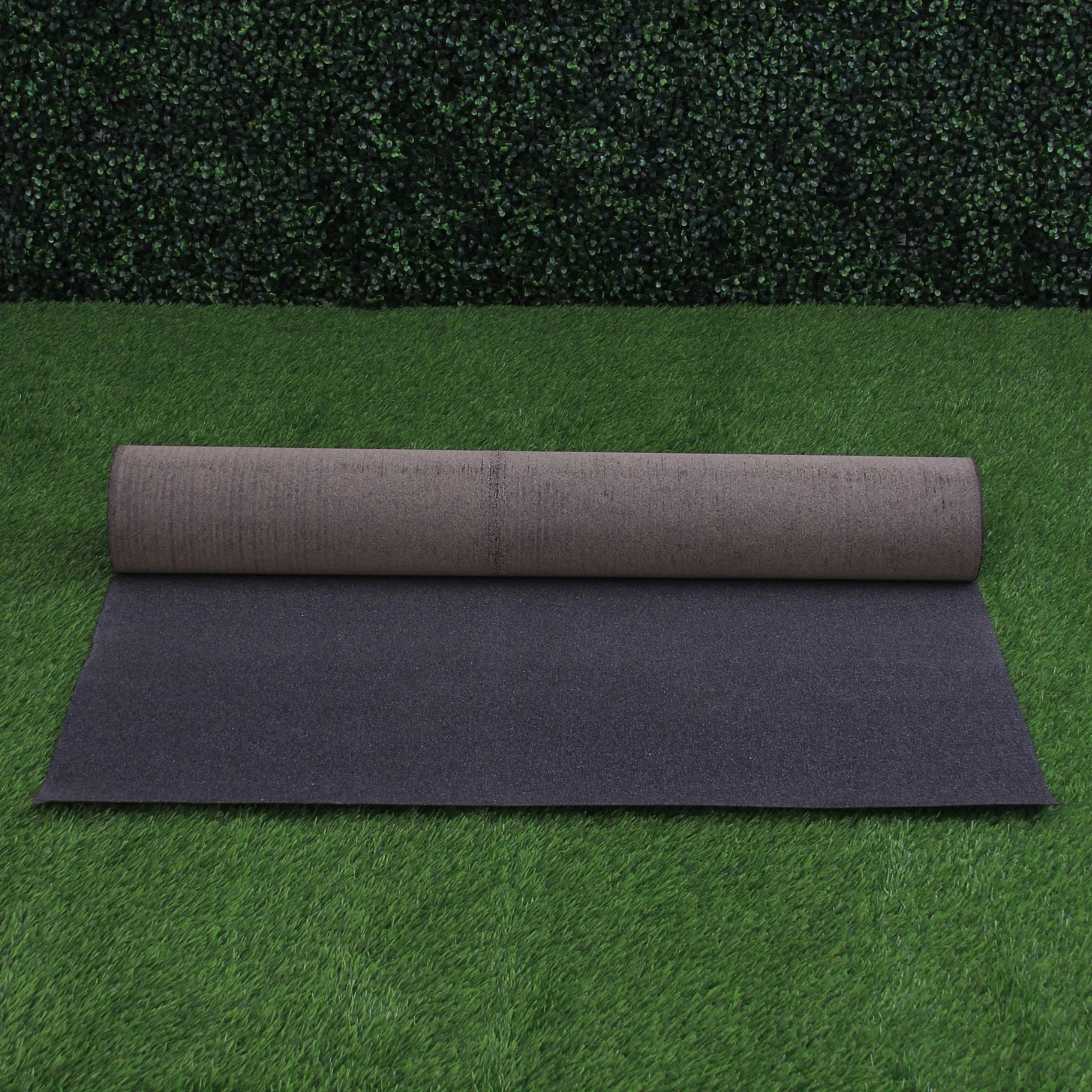 a roll of black roofing felt partially unrolled