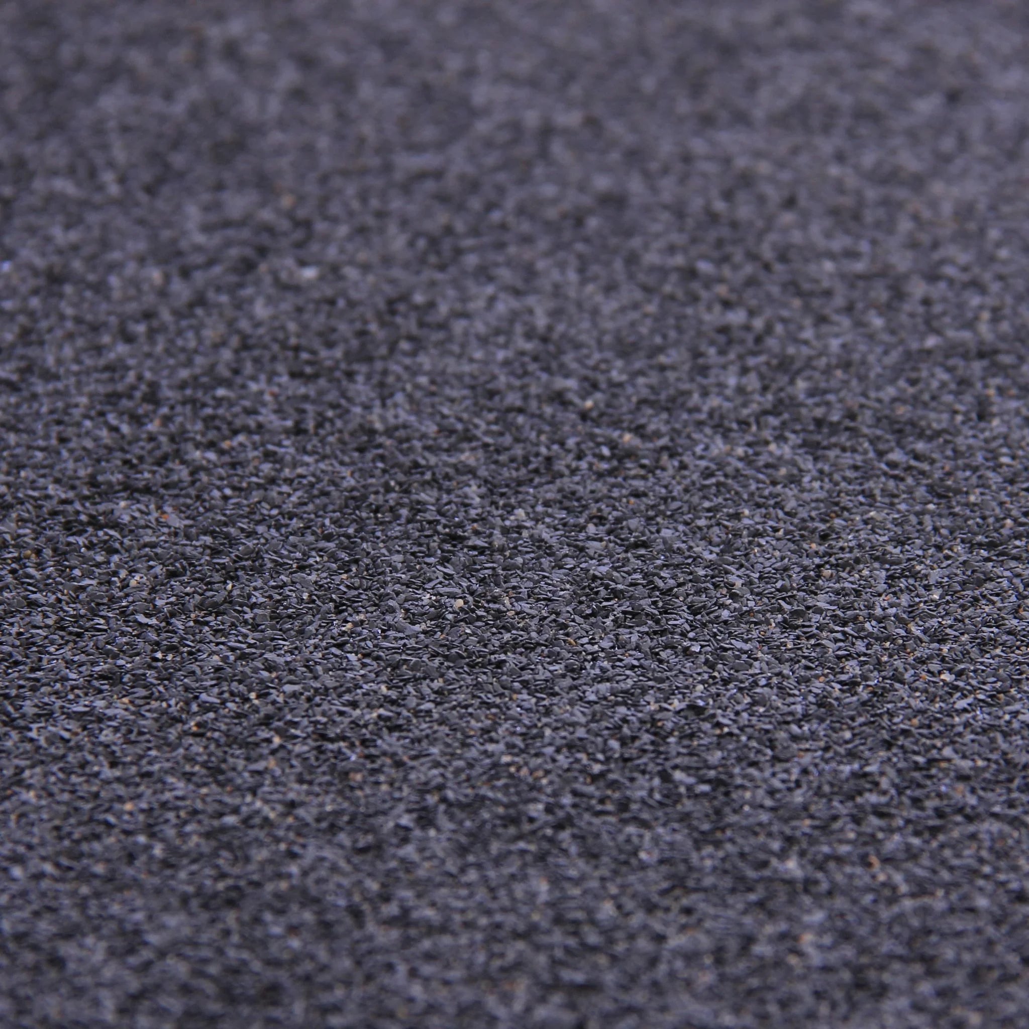 close-up of black roofing felt texture mineral finish