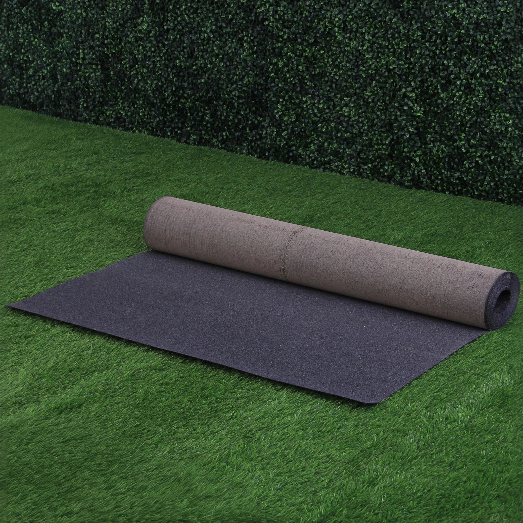 black roofing felt roll fully unrolled on grass