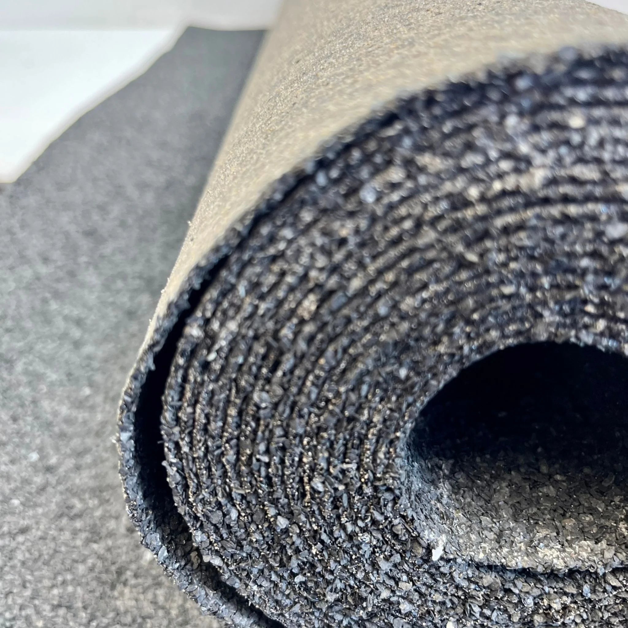 close-up of black roofing felt edge