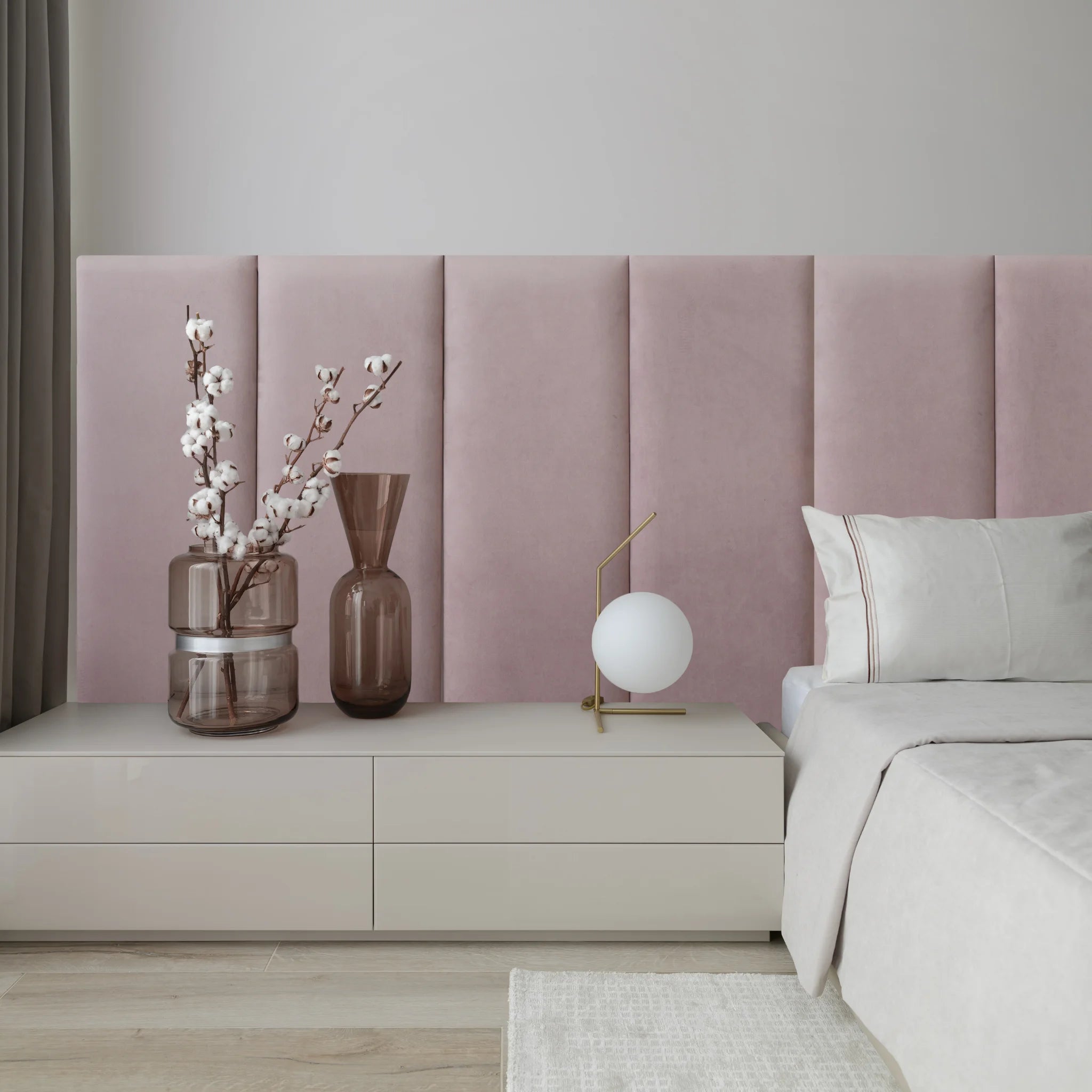 A cozy bedroom featuring pink headboards for beds