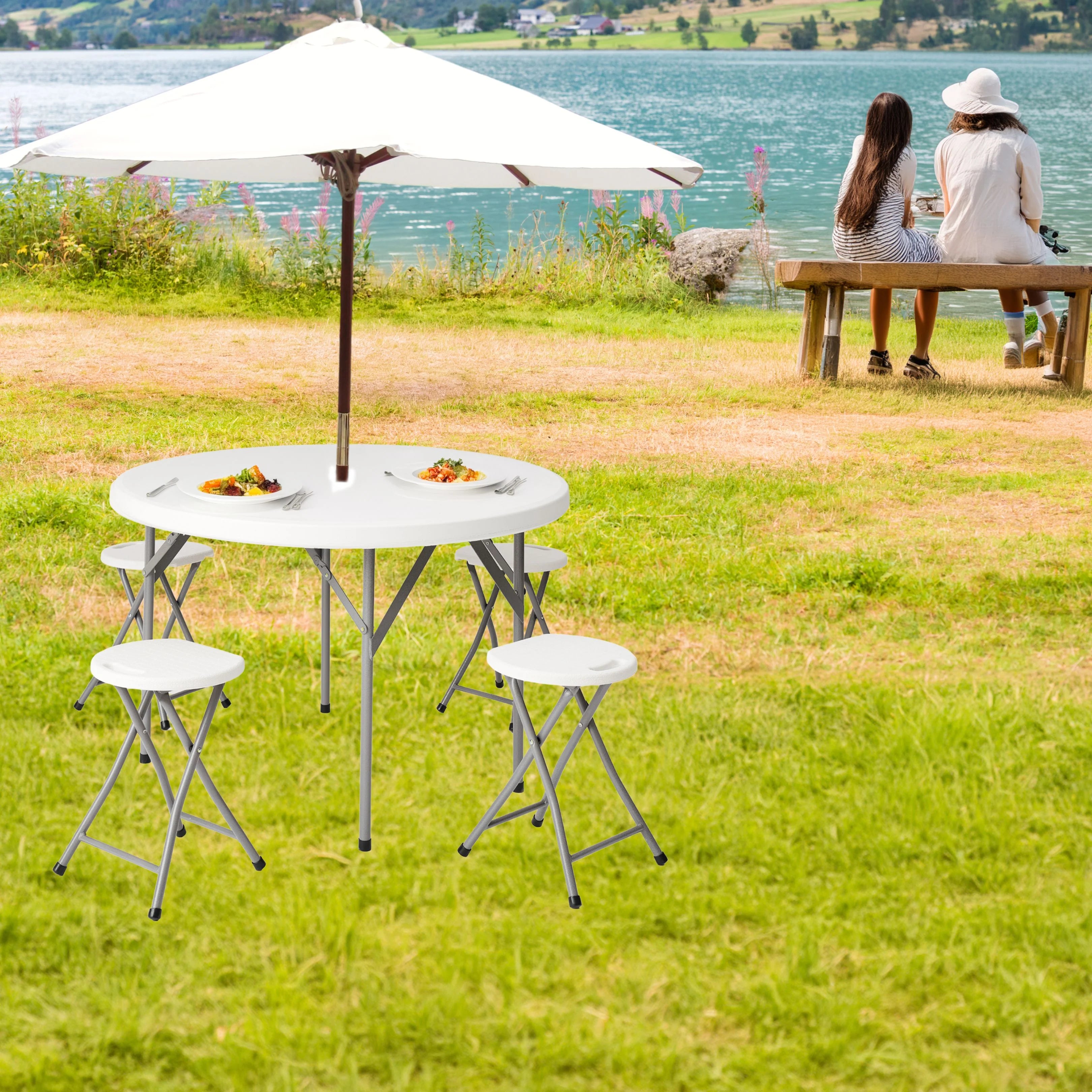 white round folding table and stool in use at outdoor picnic