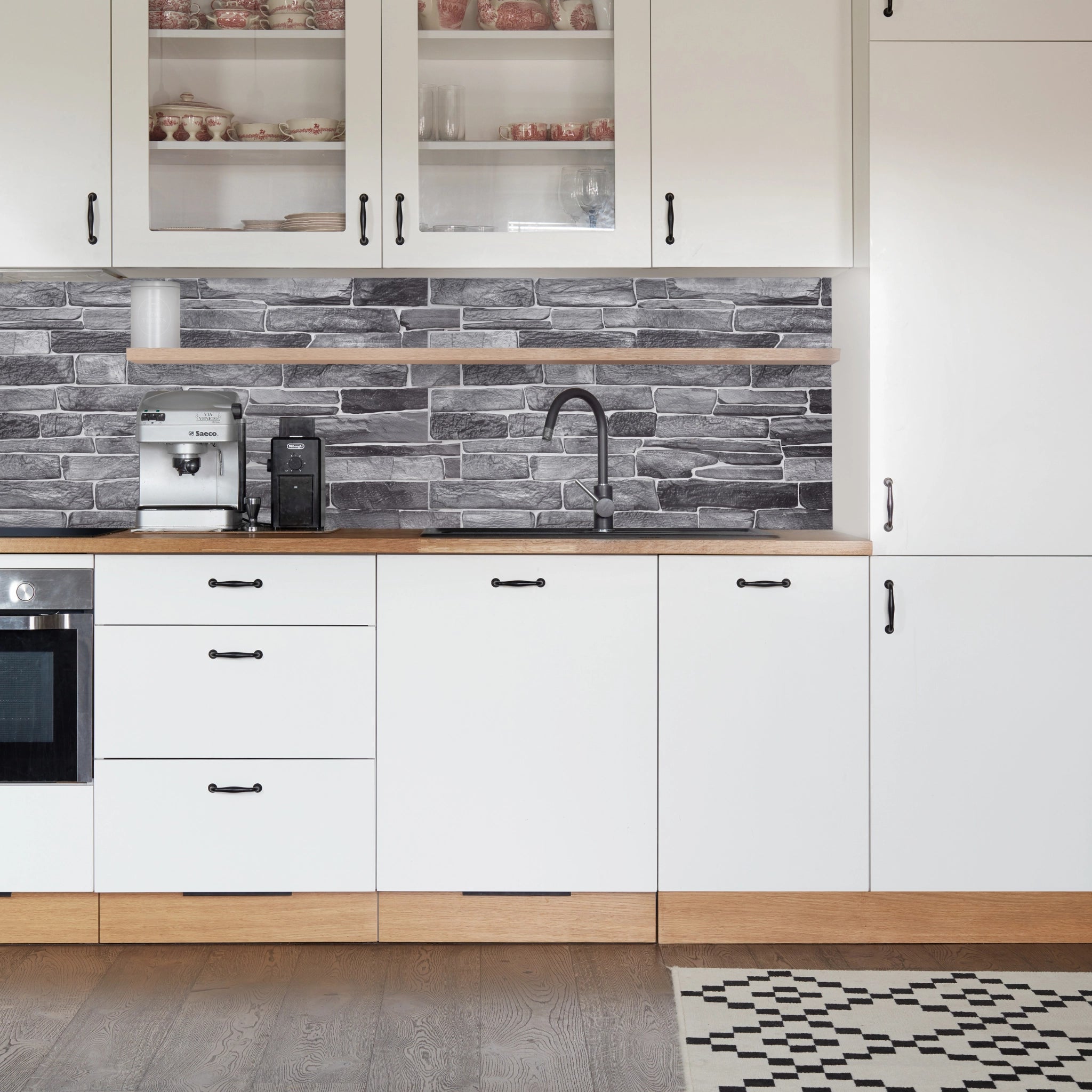 Kitchen with grey geometric-patterned wall panels and modern decor