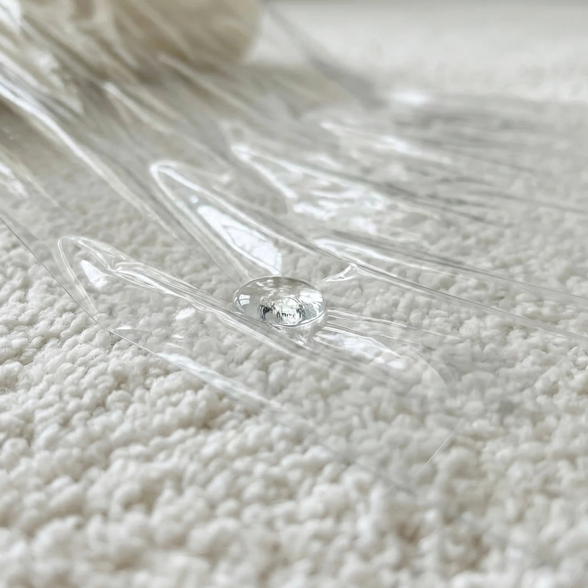 transparent protective film sheet on white carpet