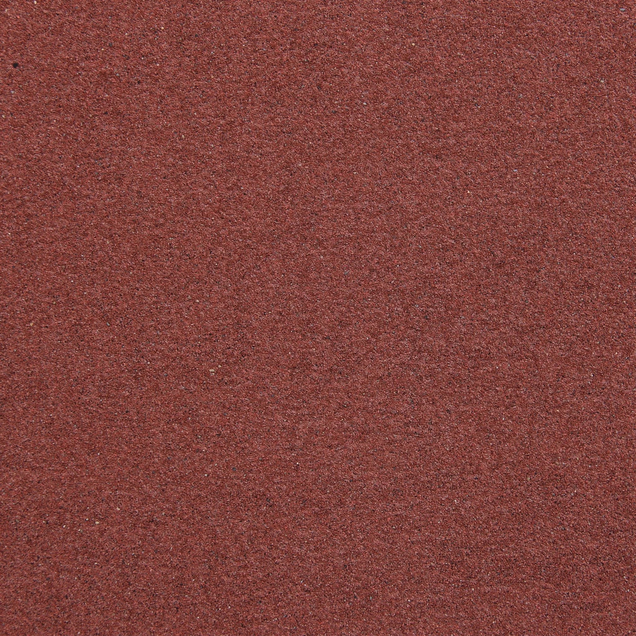 close-up of red roofing felt texture mineral finish