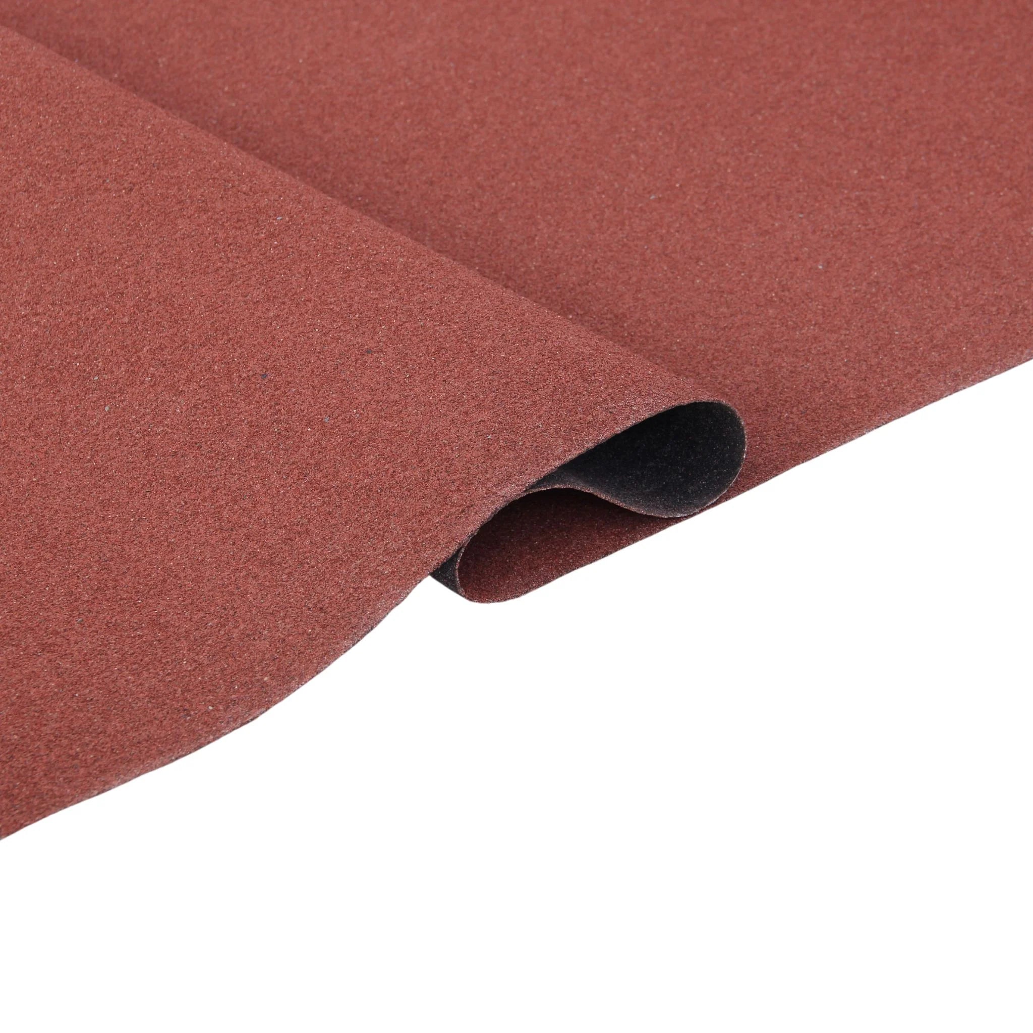 a roll of red roofing felt partially unrolled