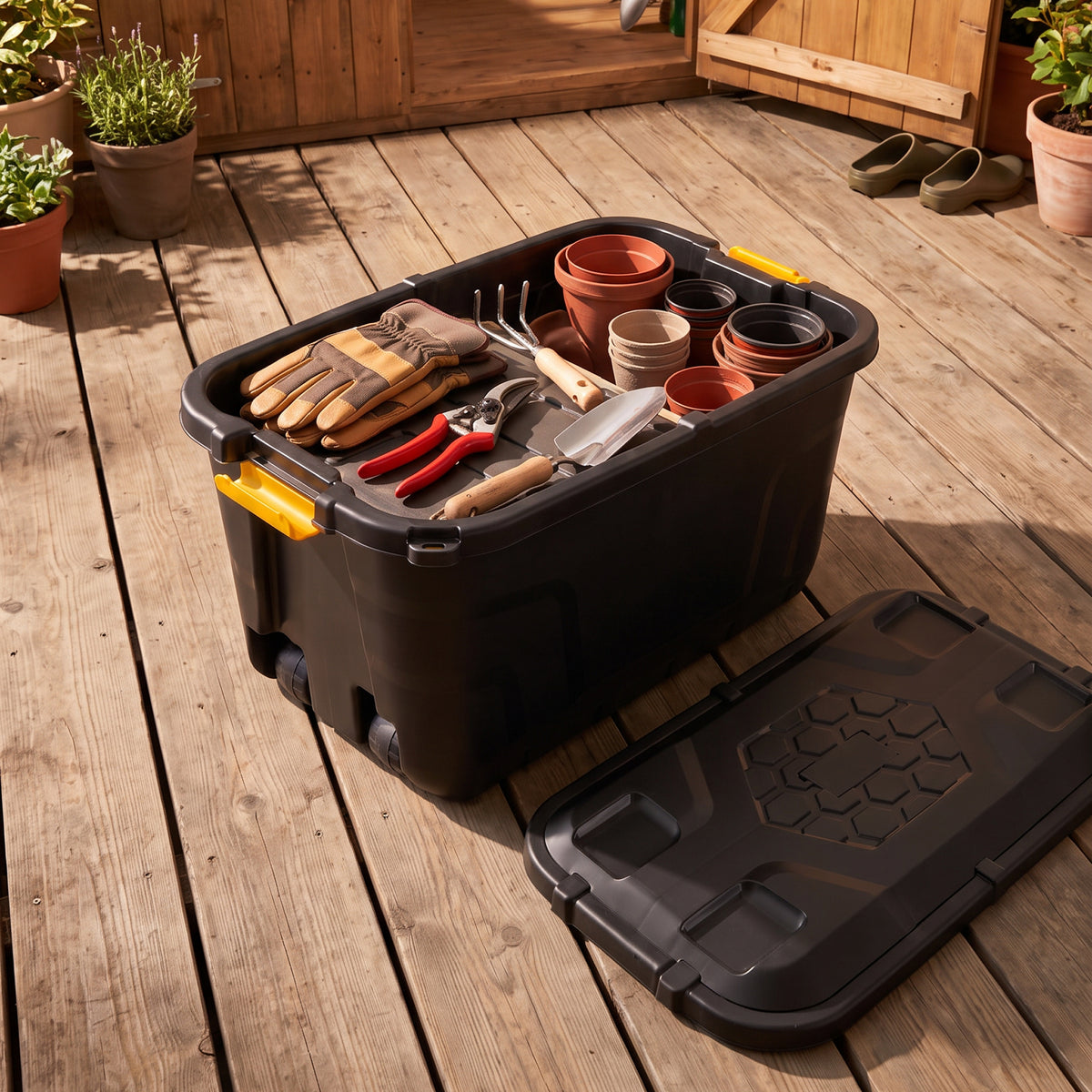 Wheeled storage box with gardening tools
