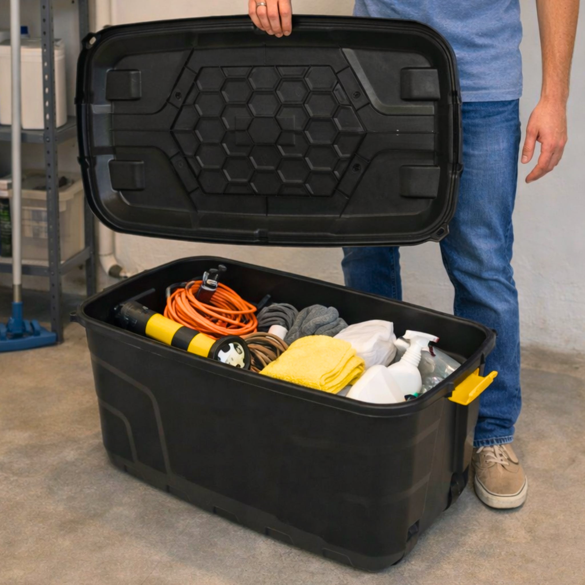 Open box filled with tools and cleaning gear