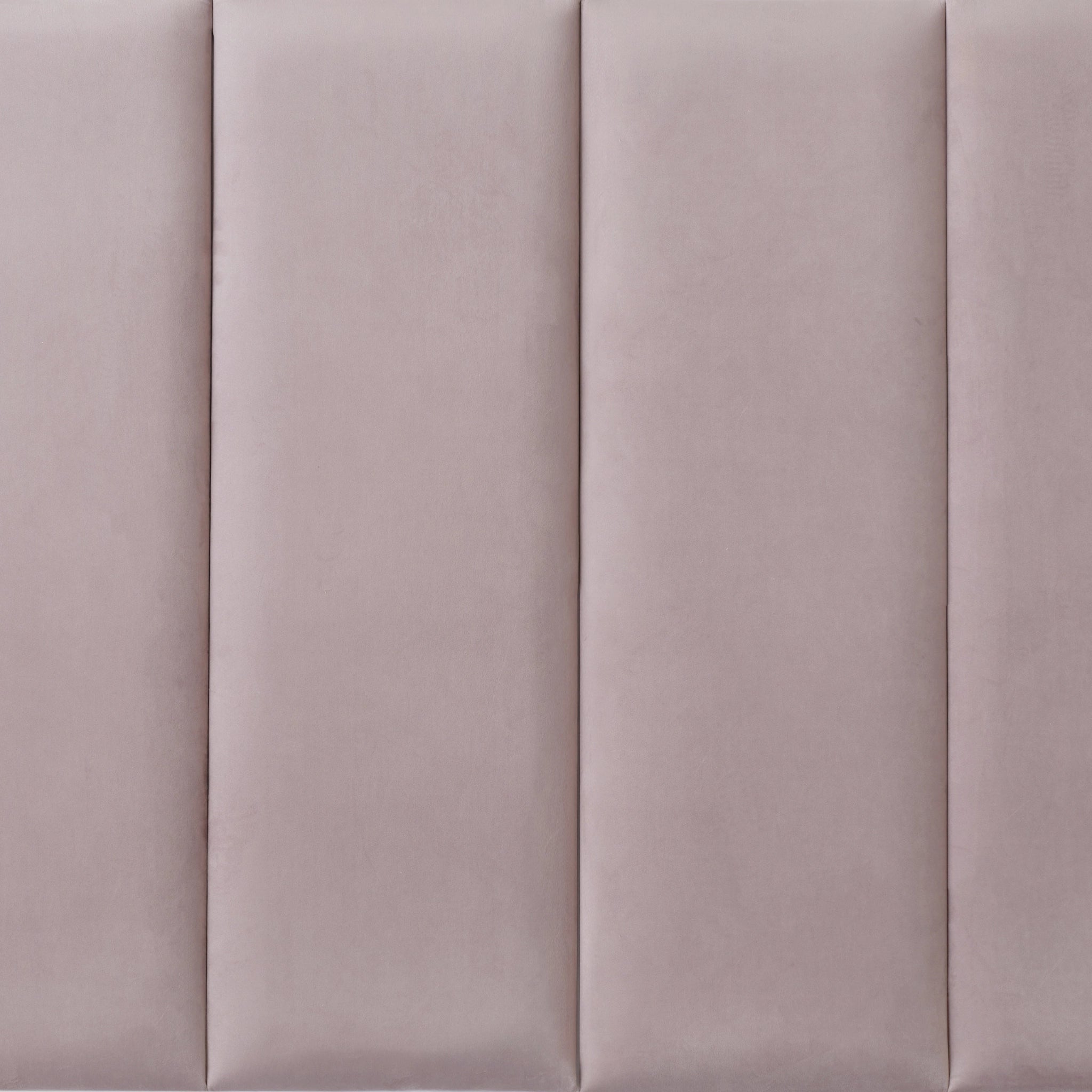 Pink upholstered wall panel with padded surface, close-up view