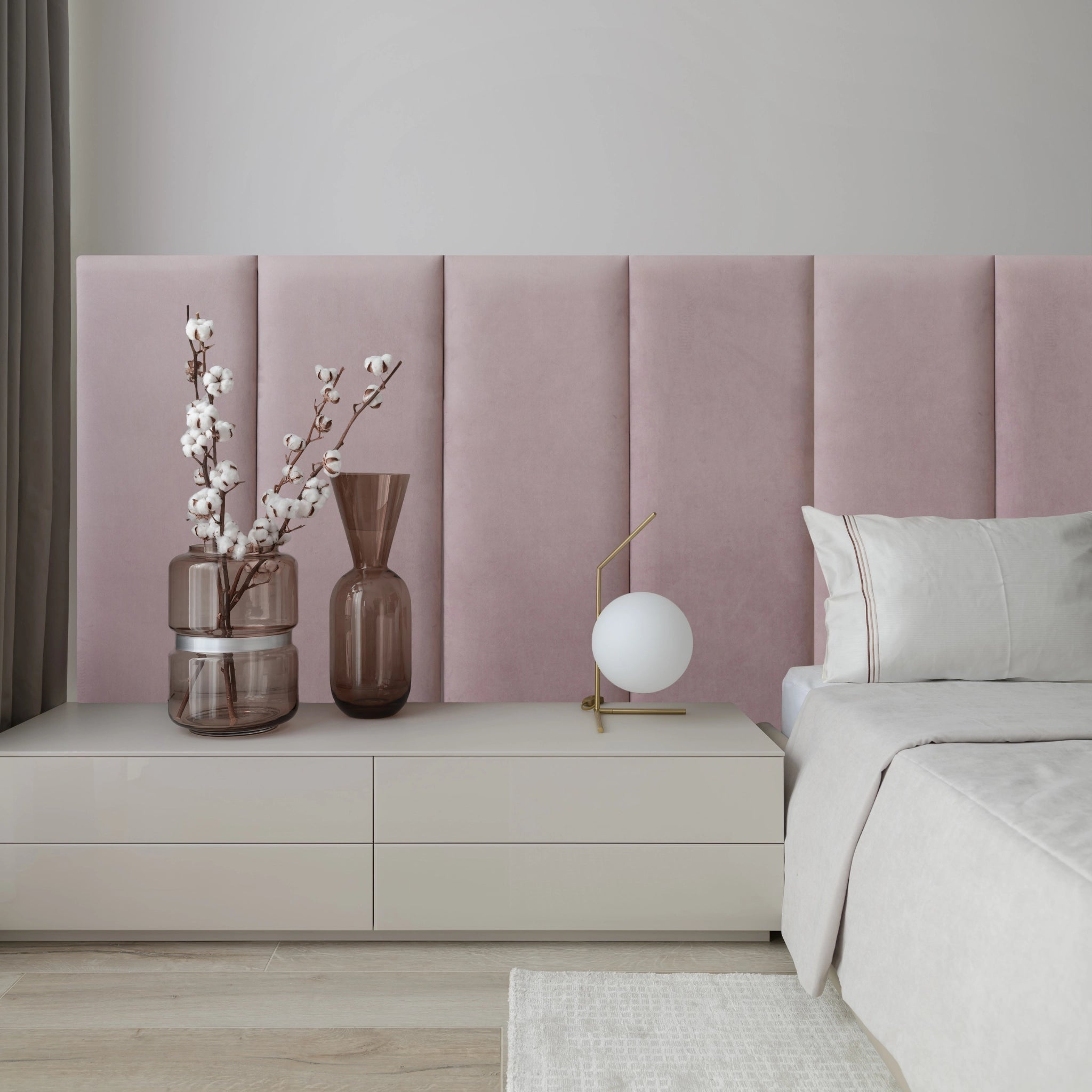 Close-up of pink upholstered wall panel with elegant design