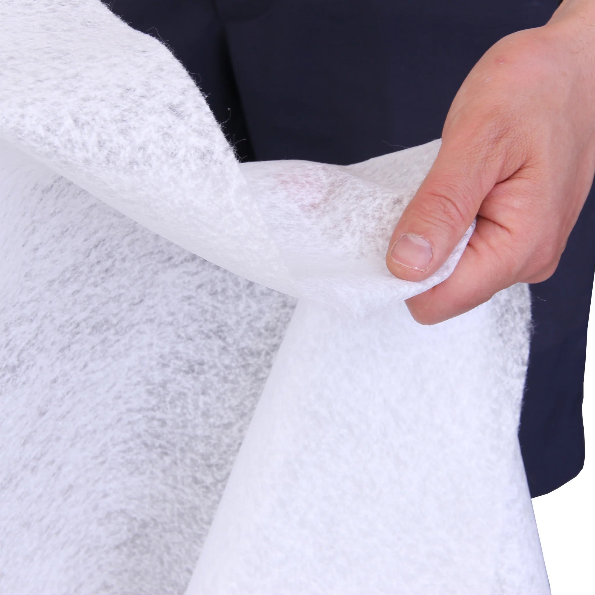 Hand holding nonwoven geotextile membrane sheet