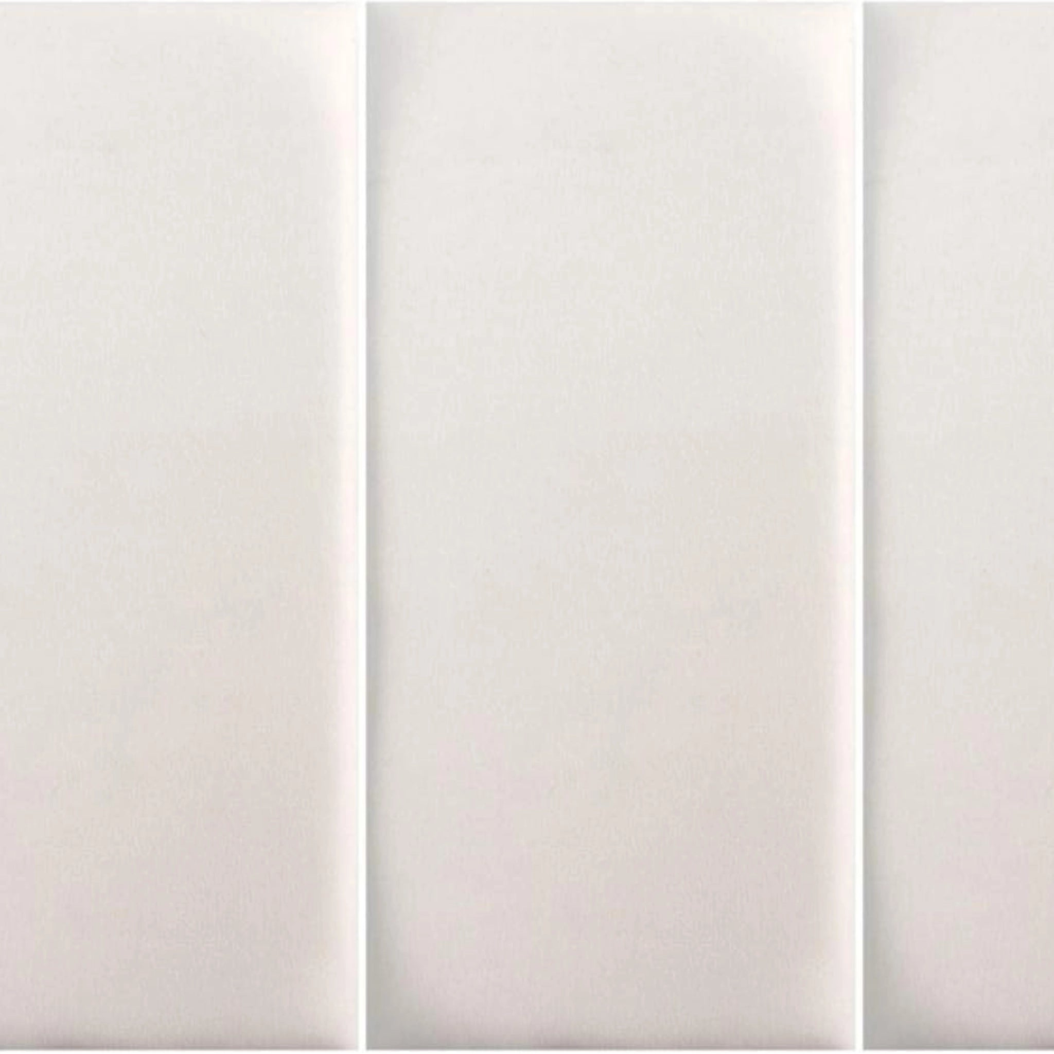 White upholstered wall panel with padded surface, close-up view