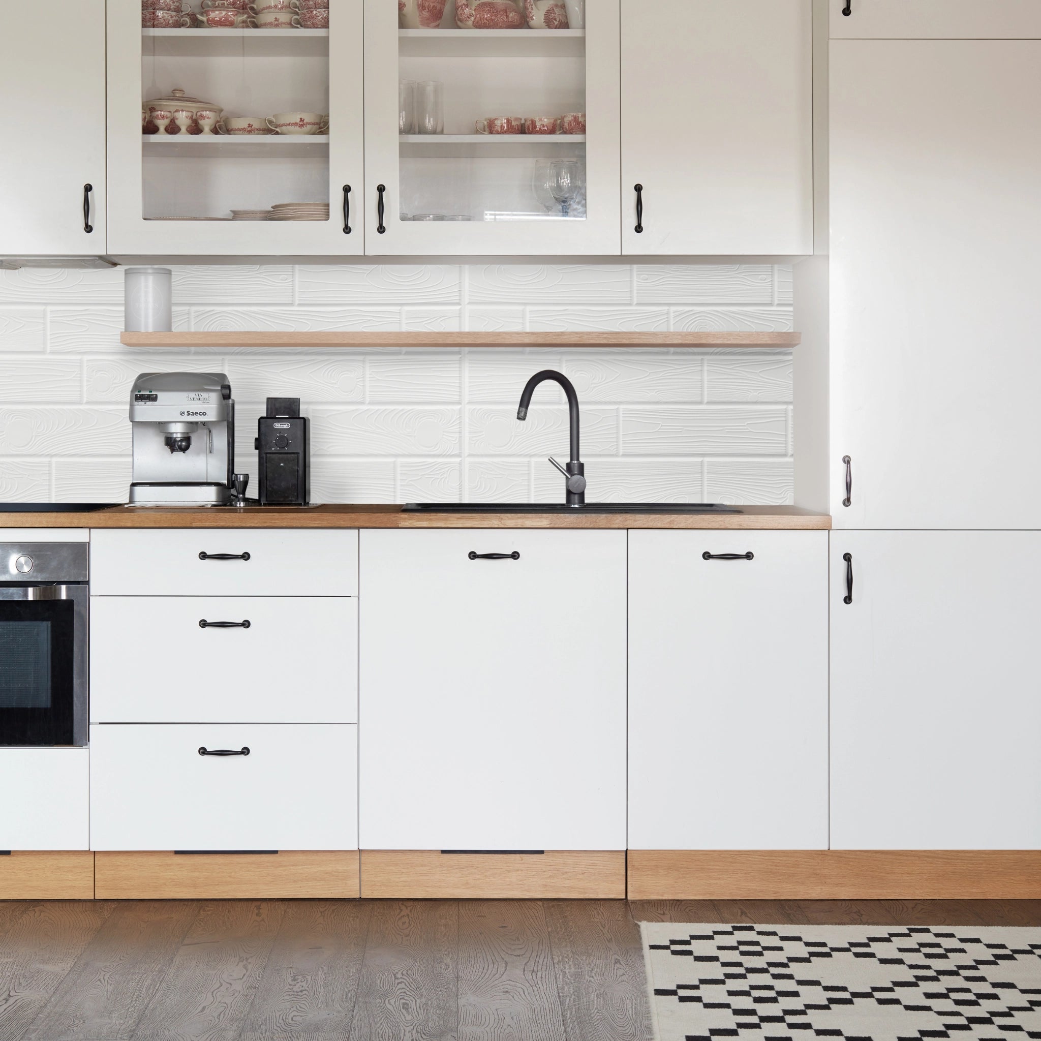 Kitchen with white geometric-patterned wall panels and modern decor