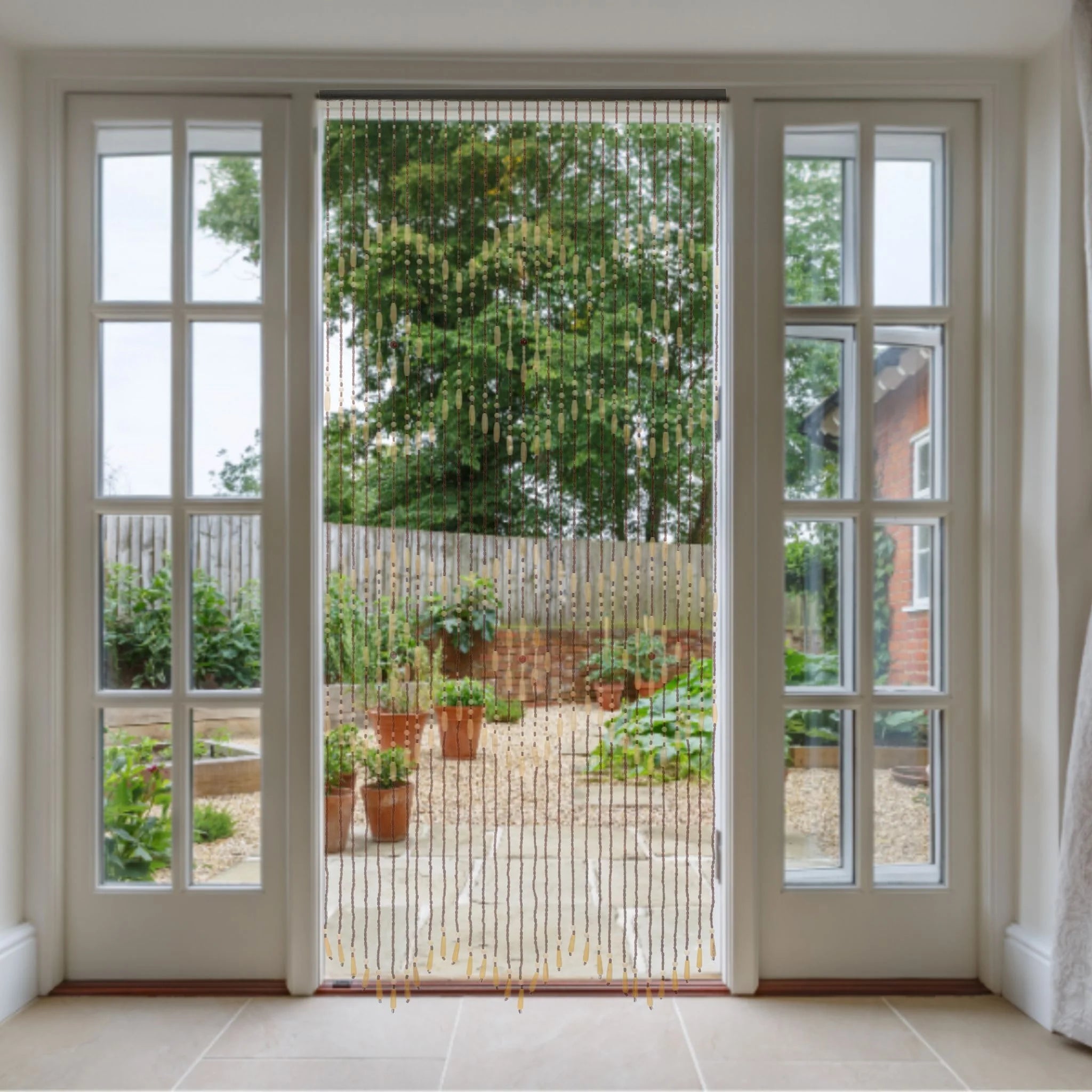 Bead door curtain hanging in doorway to garden