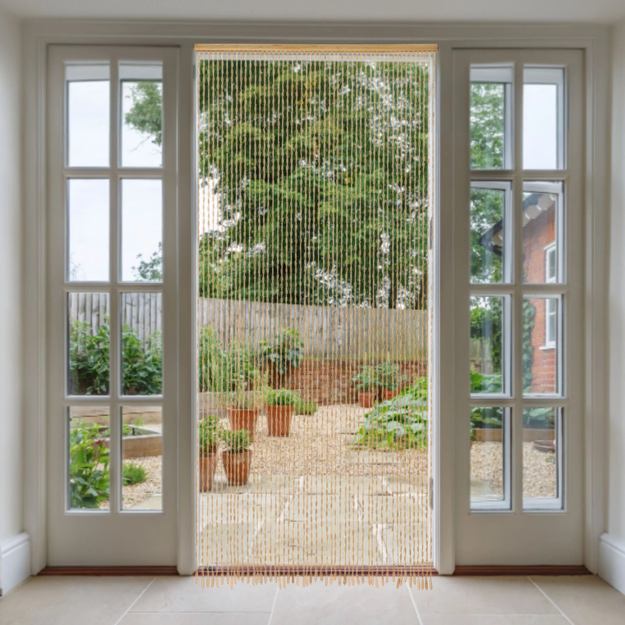 Bead door curtain hanging in doorway to garden